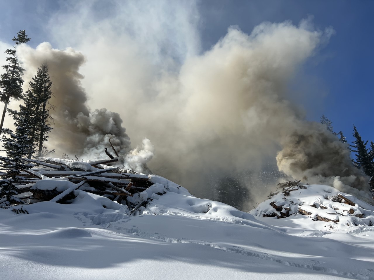 

						 Large RX piles creating smoke during initial stages of burn - Baldy Pine RX pile burn
			