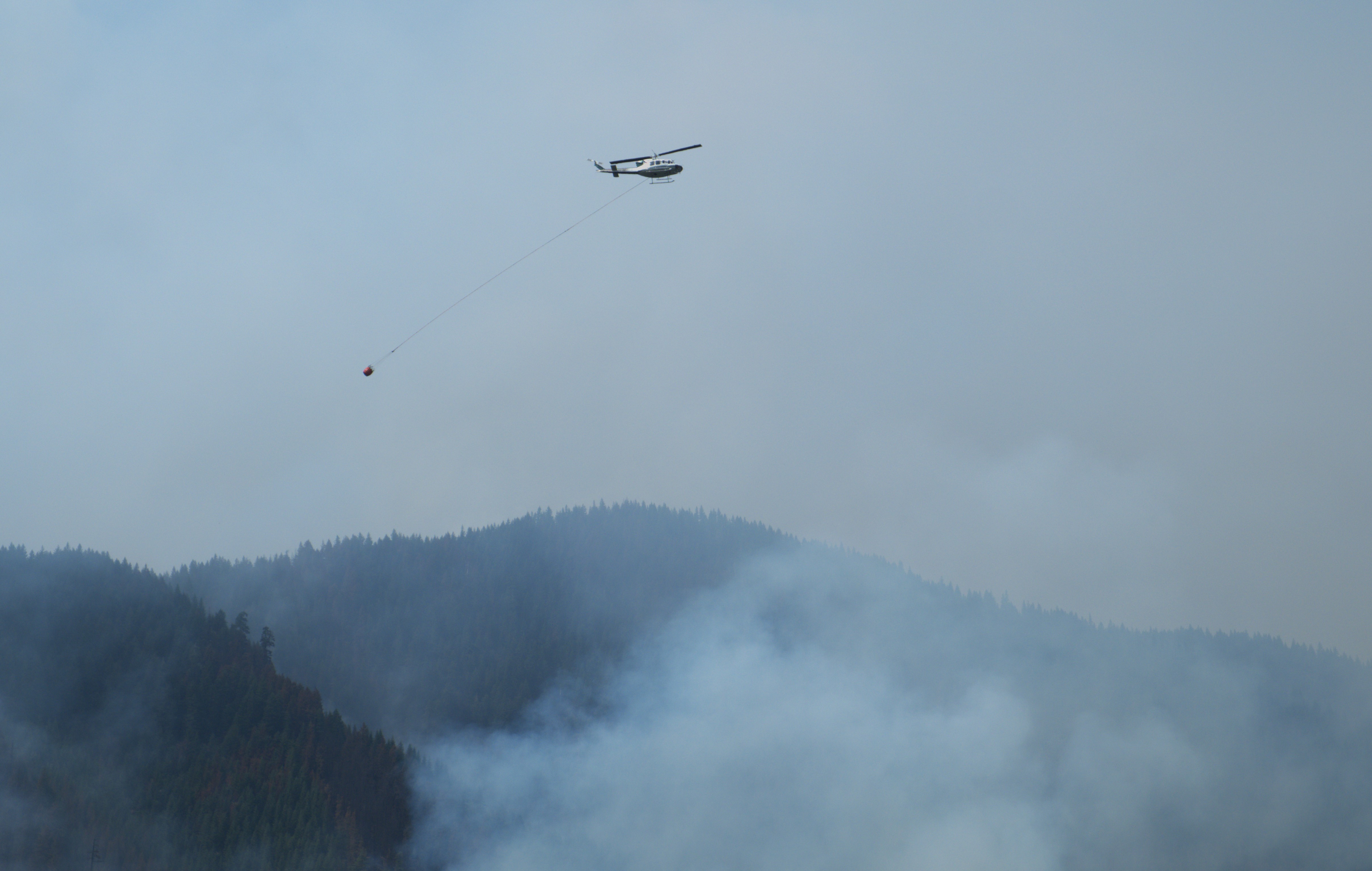

						Aviation Resources drop buckets on the Ore Fire
			