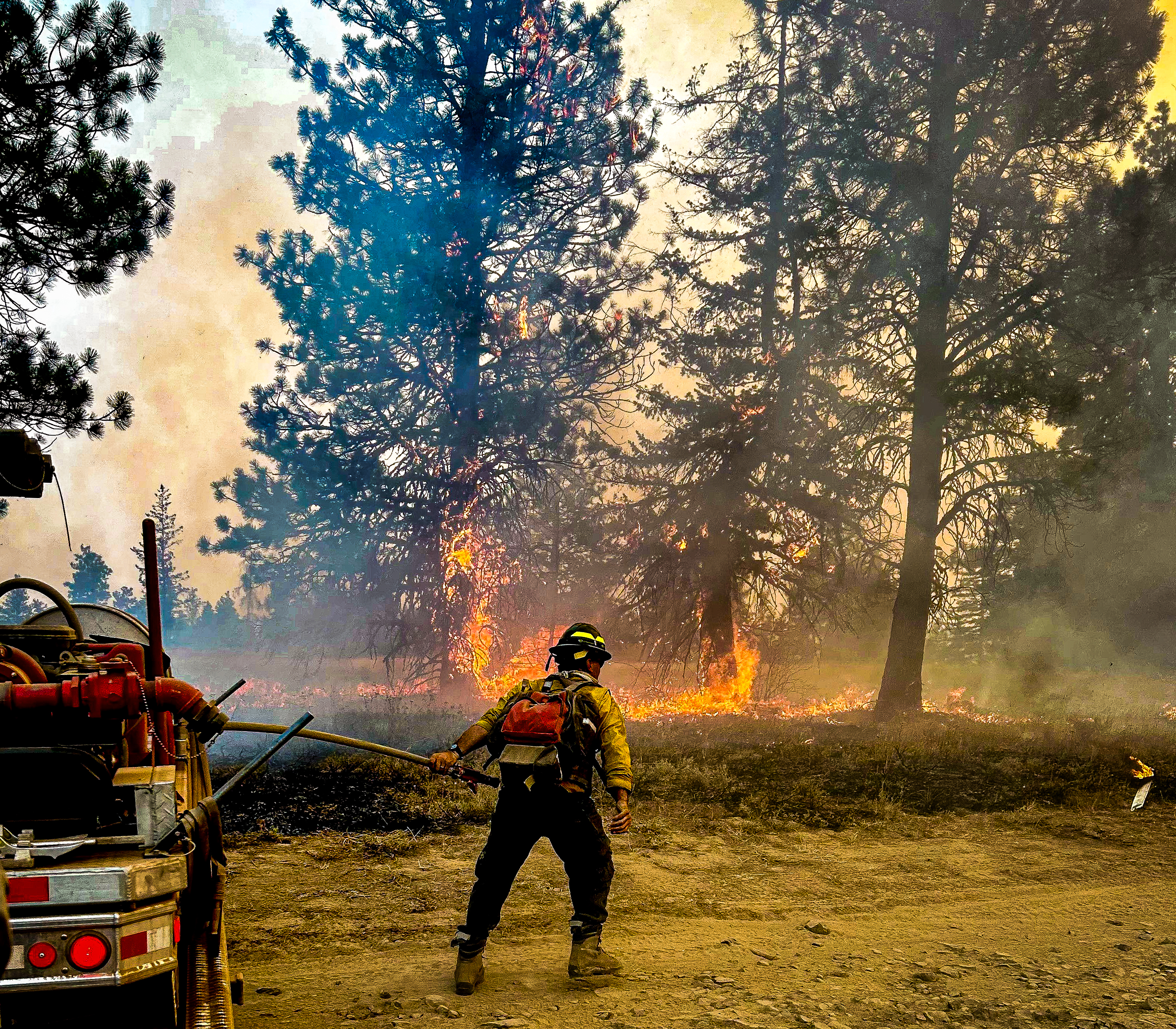 

						Firefighter Holding the Fire Line 
			