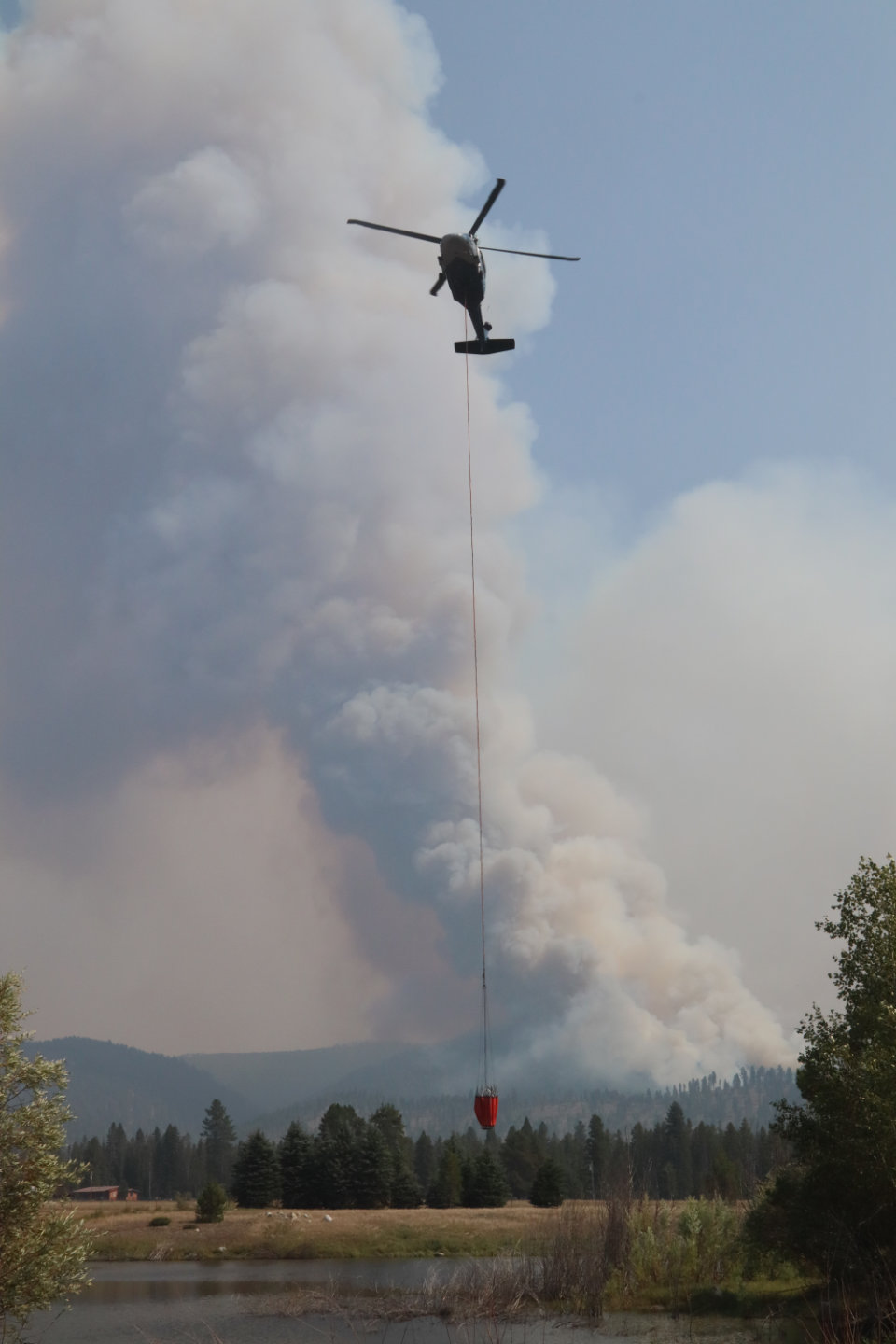 

						Helicopter Dips From Pond
			