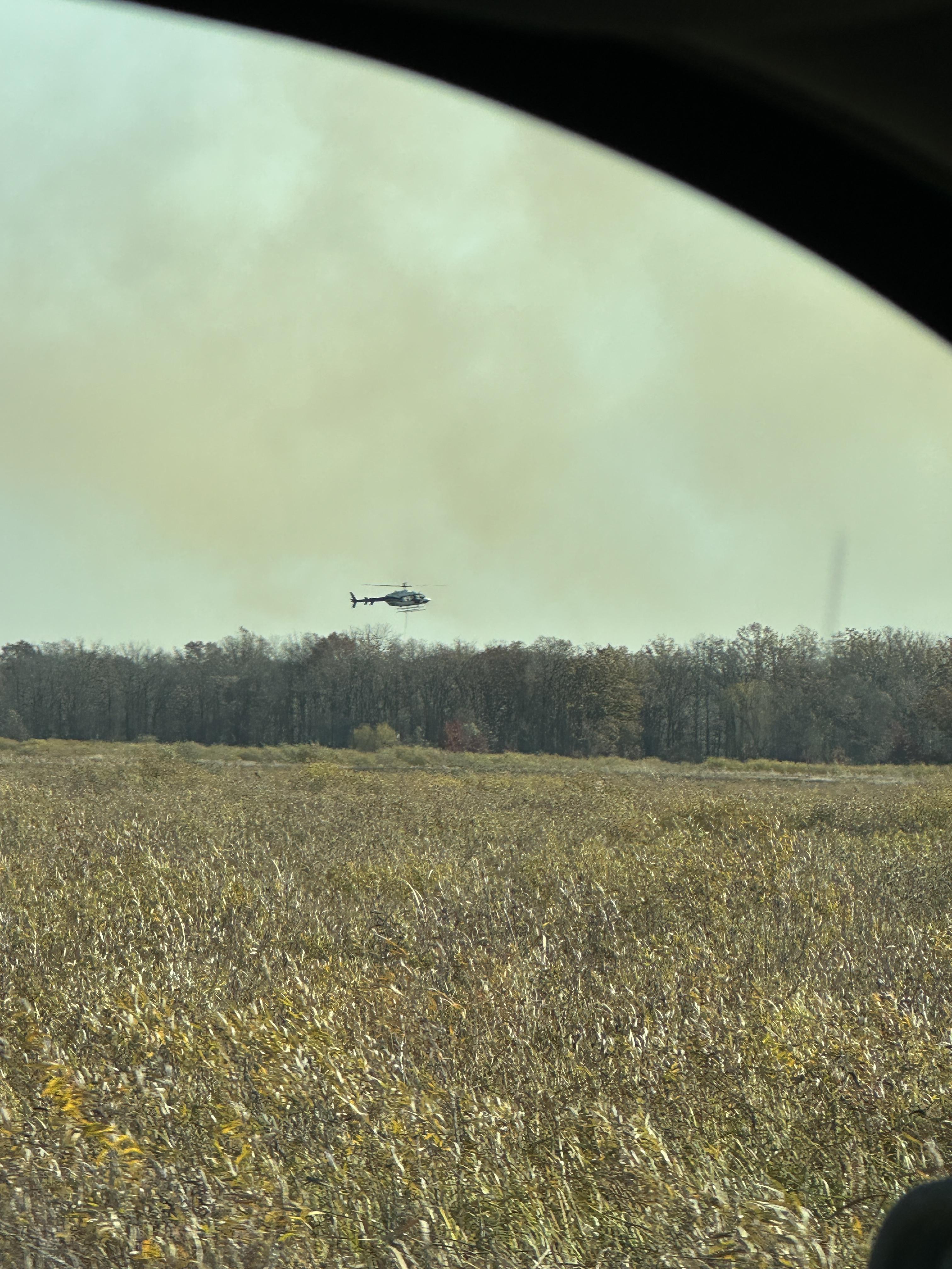 

						Helicopter working fire during initial attack 
			