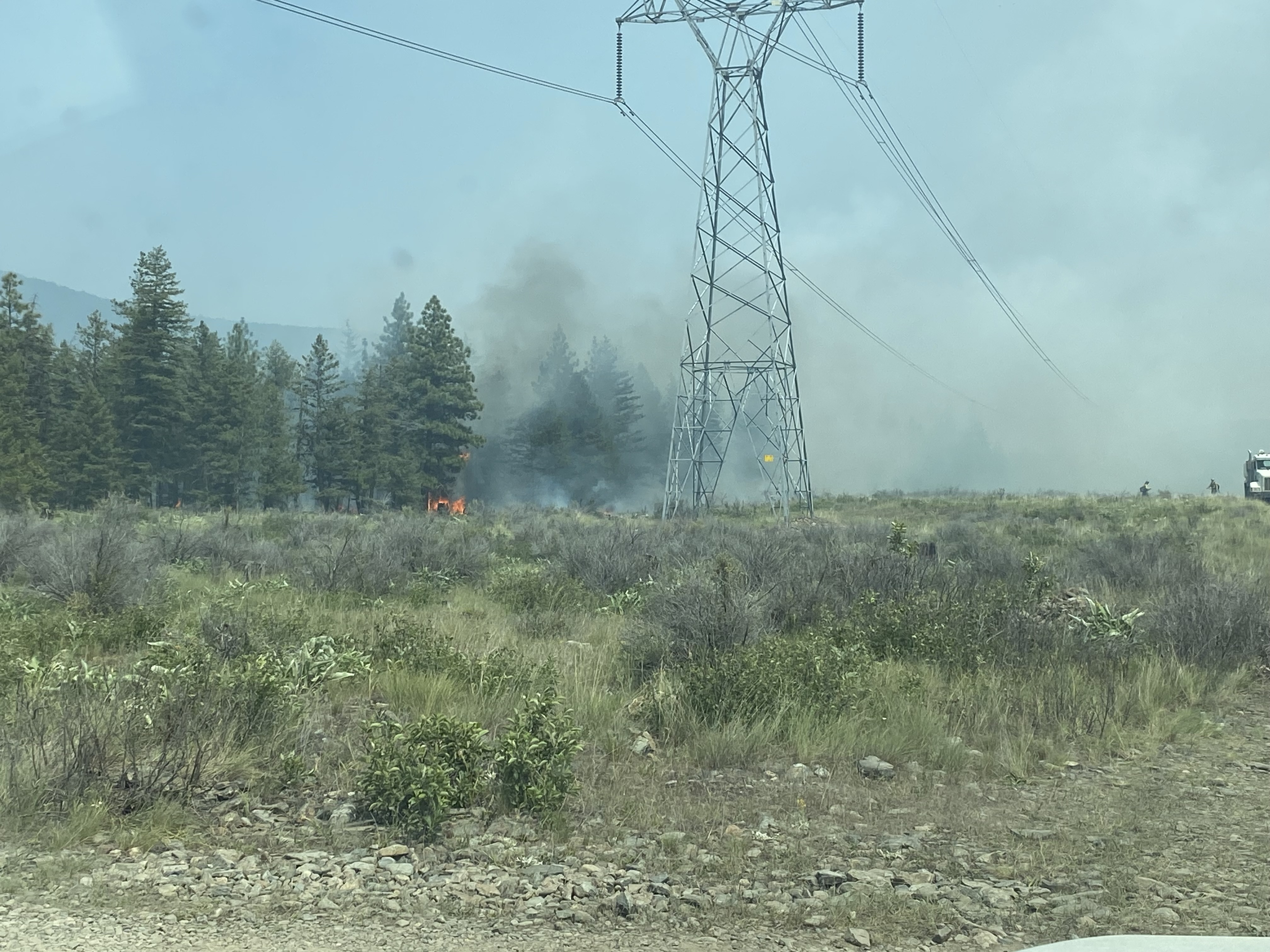 

						Banana Lake Fire burning near a power line
			