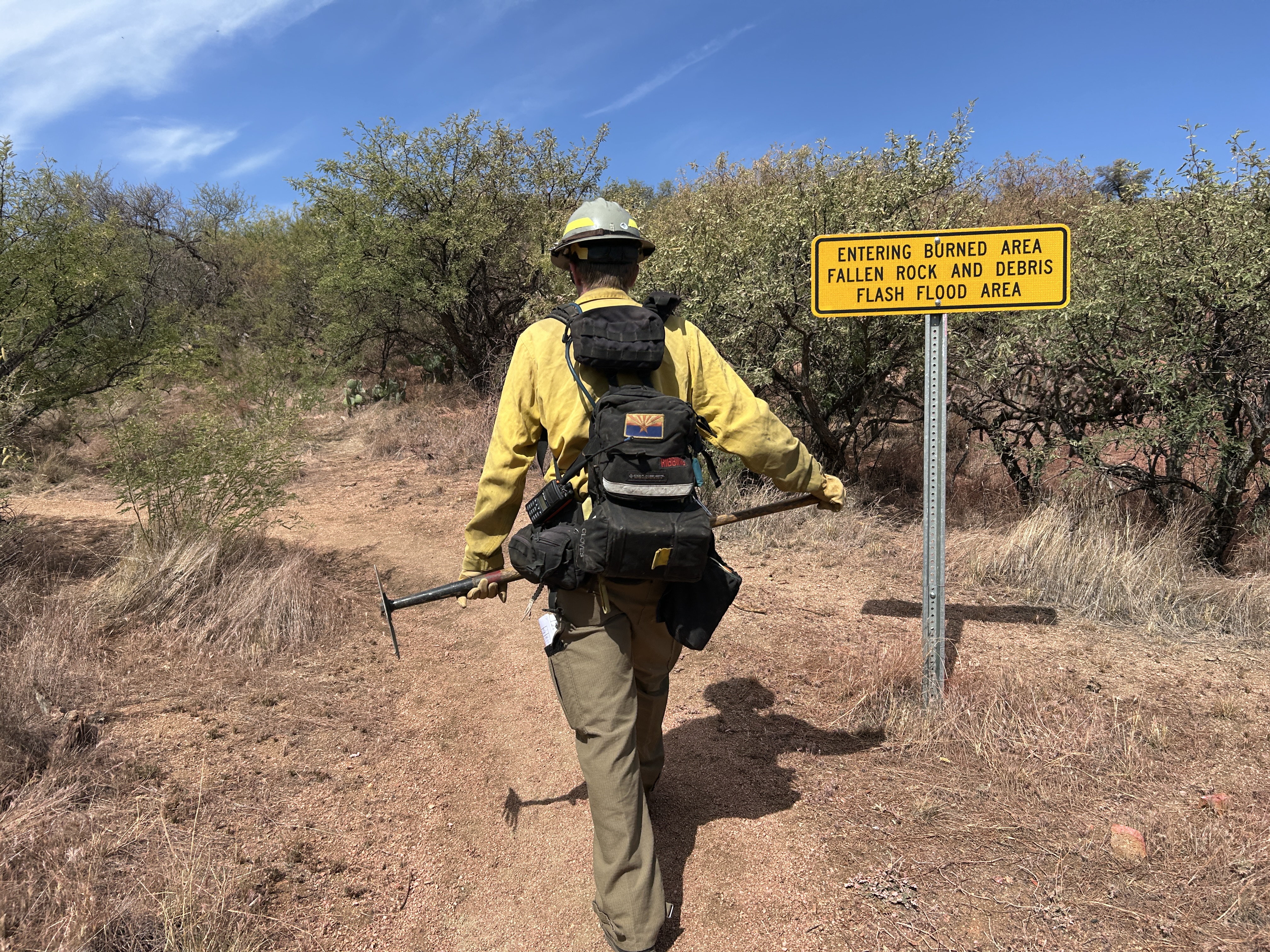 

						READ walking towards BAER sign on the AZ Trail.
			