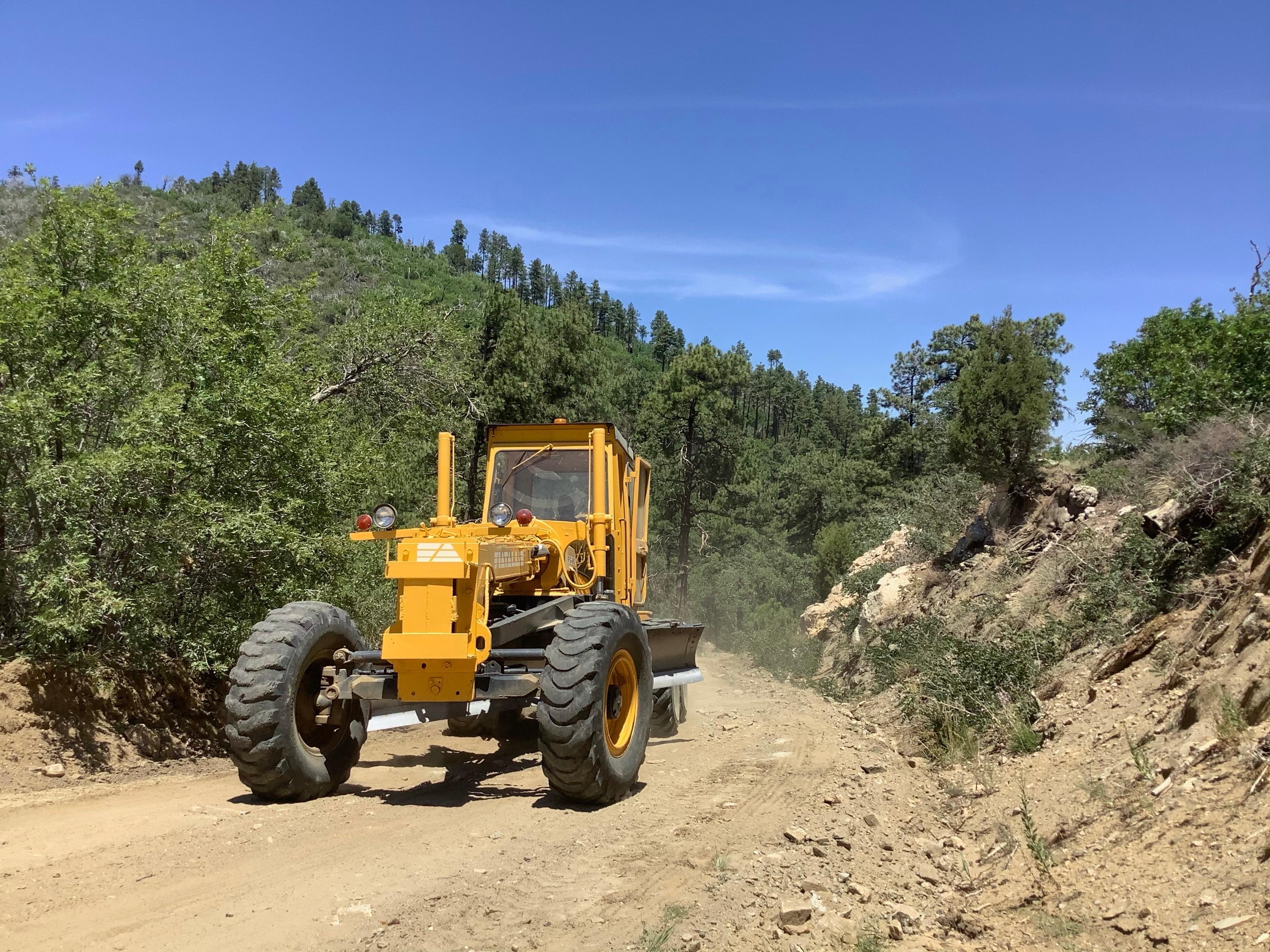 Road Grader  going through road Tiger Fire July 7,