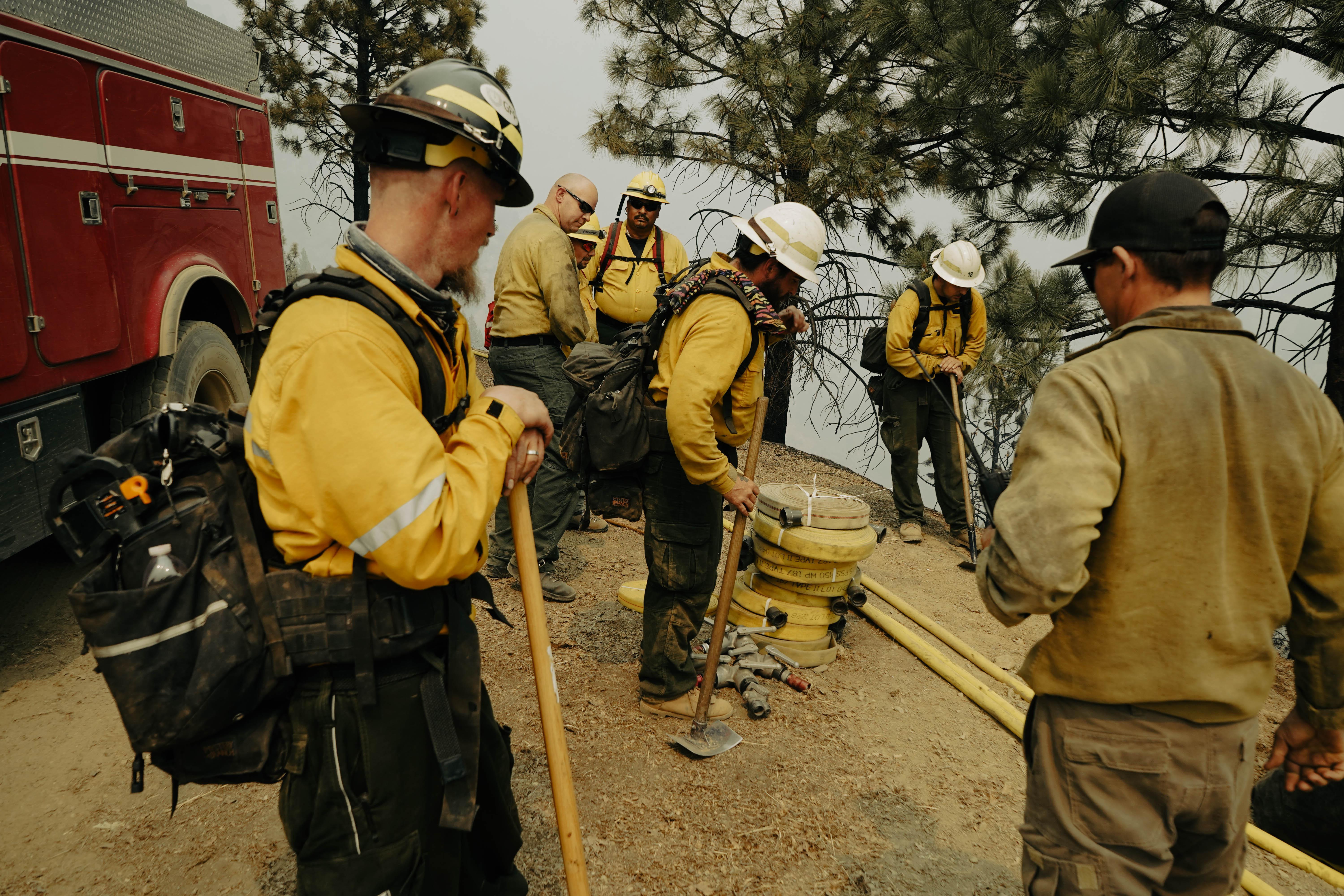 Crews with E-282, Worland FPD (Worland, Wyoming) and GFP Enterprises work to build containment lines, Aug. 22, on the Cronan Fire, one of three fires comprising the River Complex. (U.S. Forest Service photo courtesy of Benjamin Cossel)
