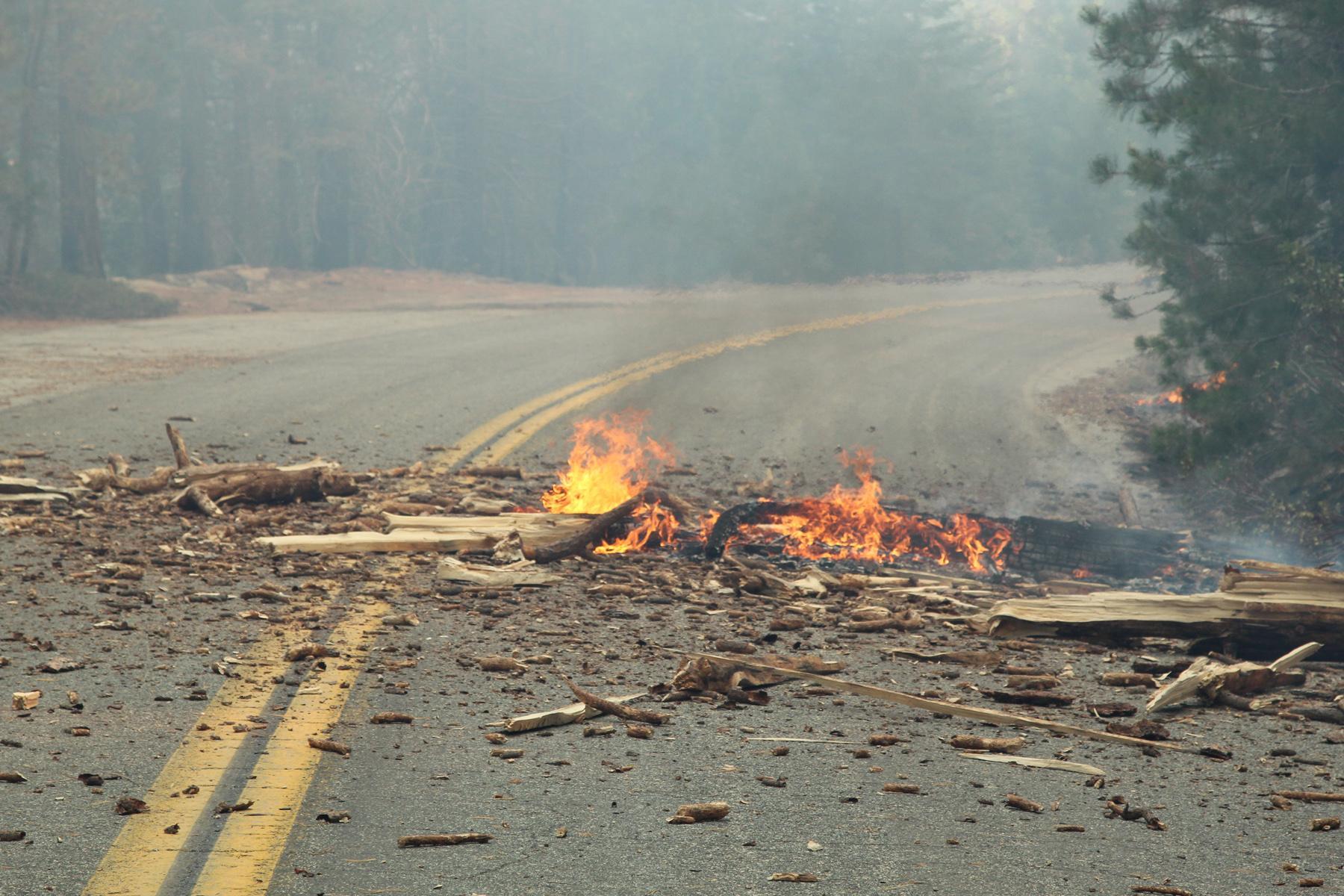 Burning Debris on Road 107. Photo: Mike McMillan - BIA
