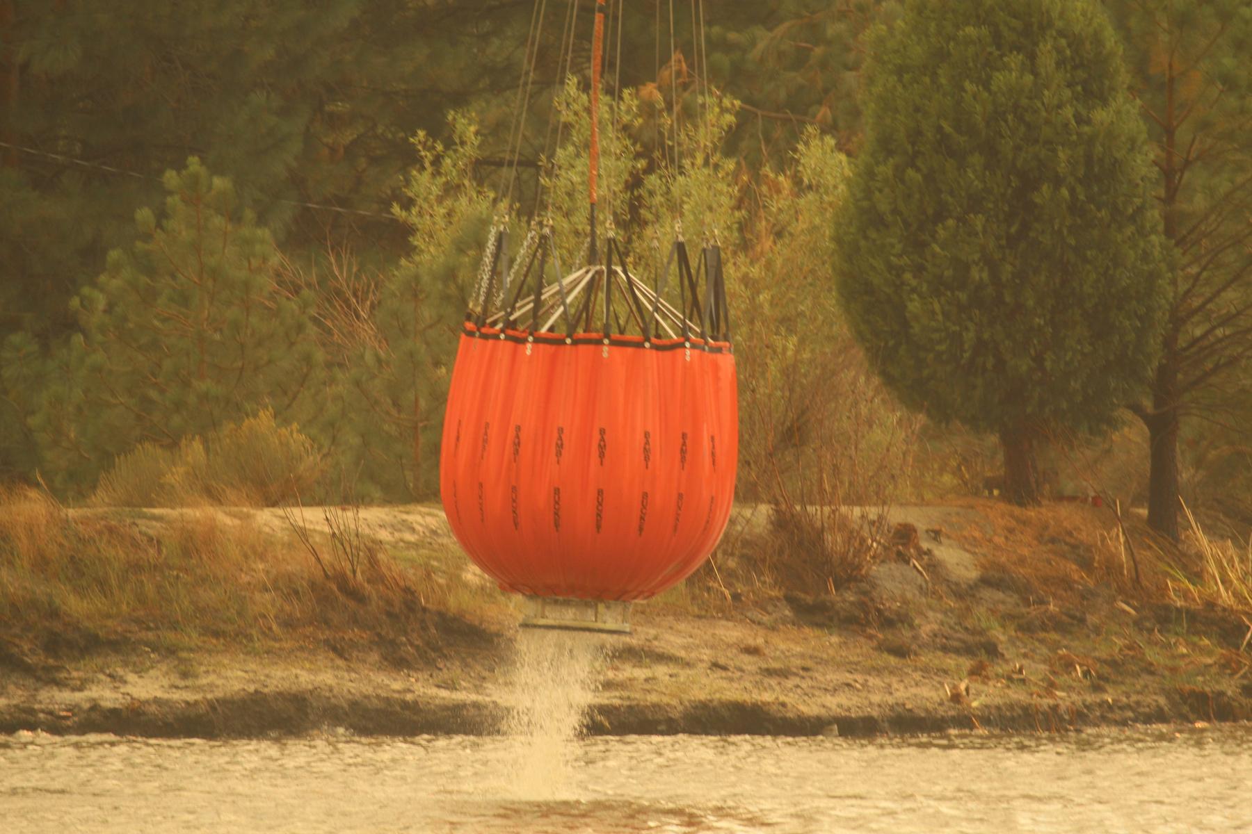 Sky Crane Helicopter Bucket Holds 1,000 Gallons. Photo: Mike McMillan - BIA