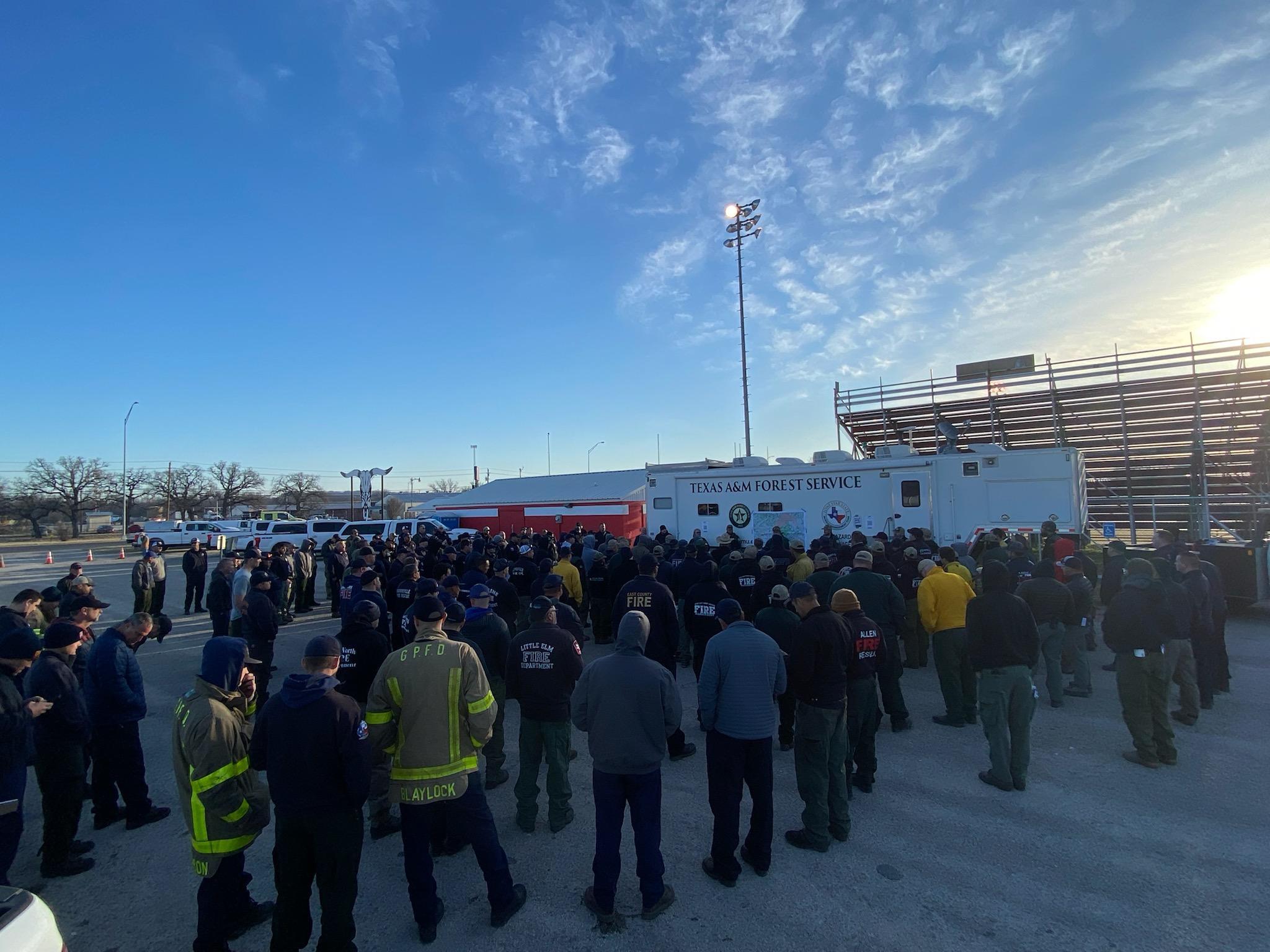 Fire crews attend morning briefing on March 19, 2022.
