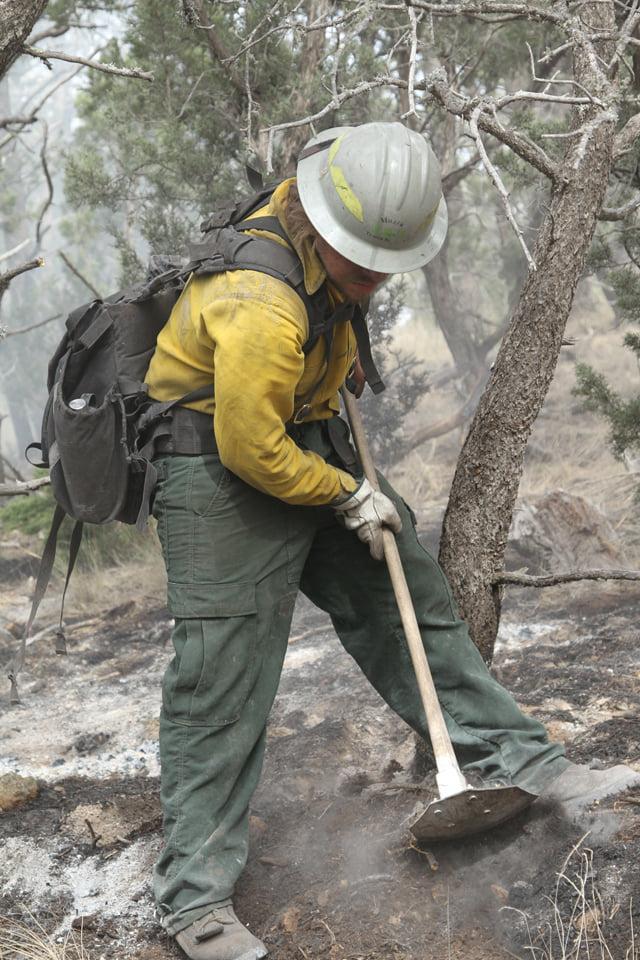 Firefighter constructing fireline on the McBride Fire