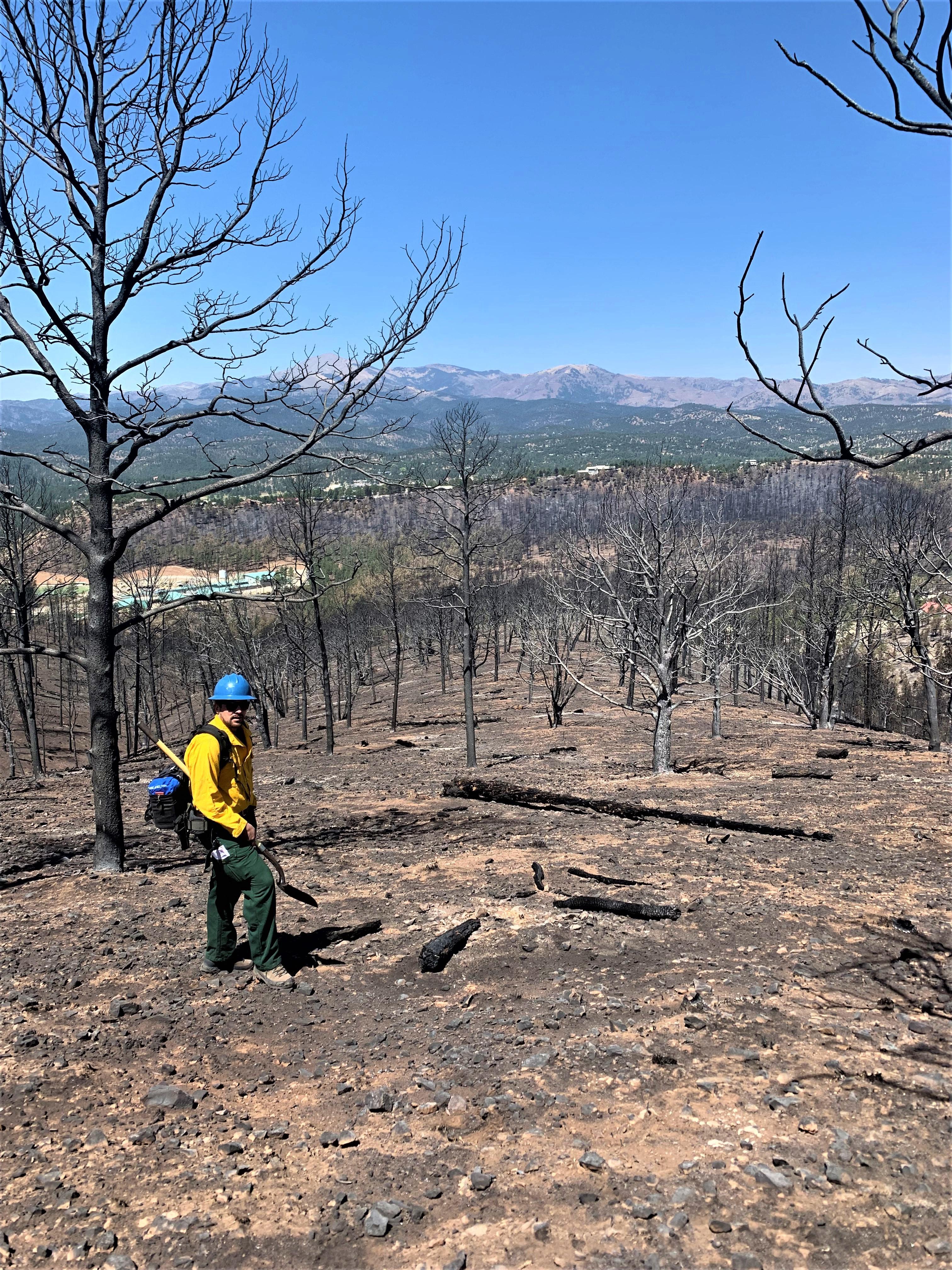 Image showing BAER Specialist hiking down ridge while assessing McBride Burn Area