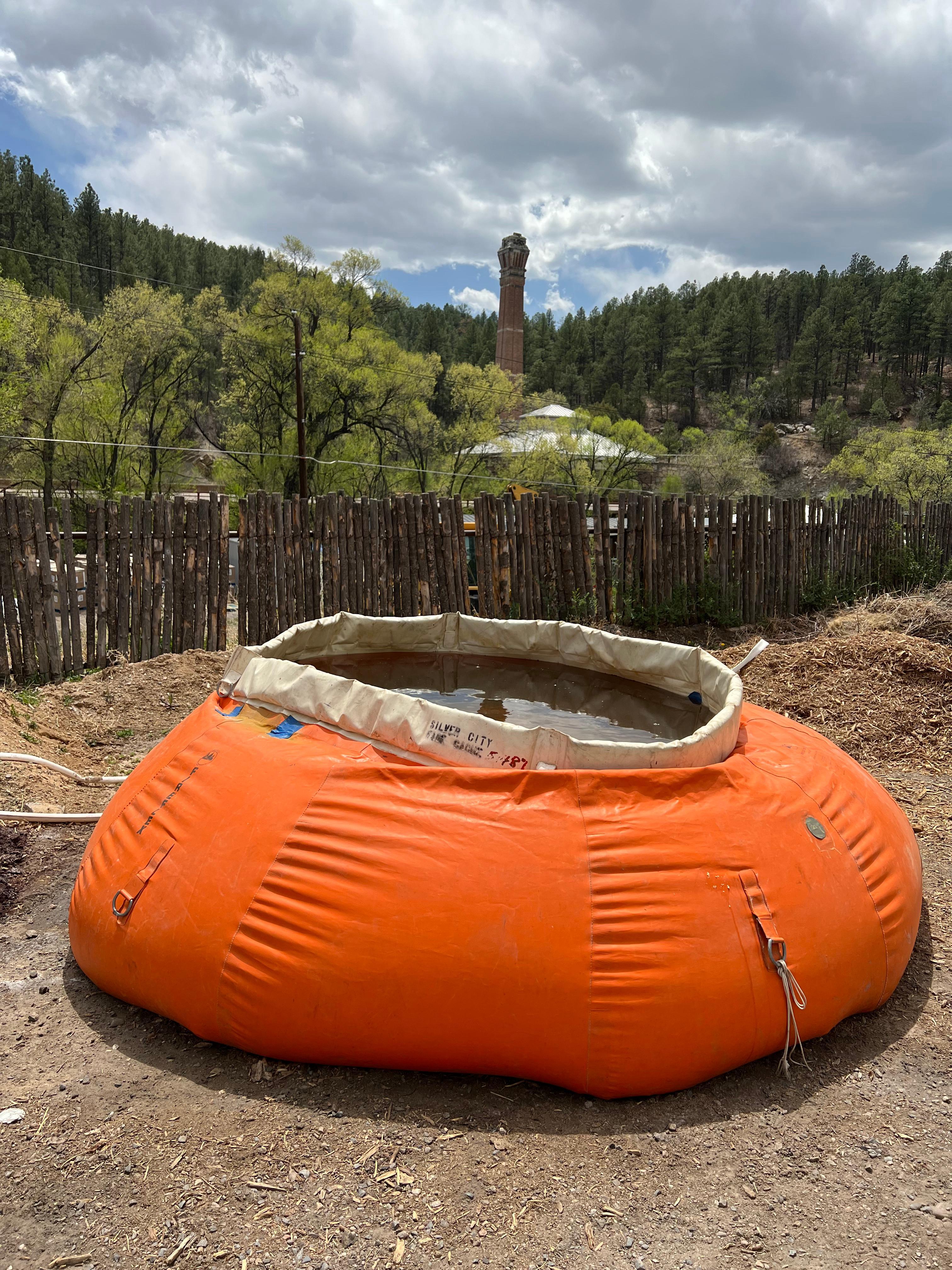 Water capture basin for firefighter use called a pumpkin