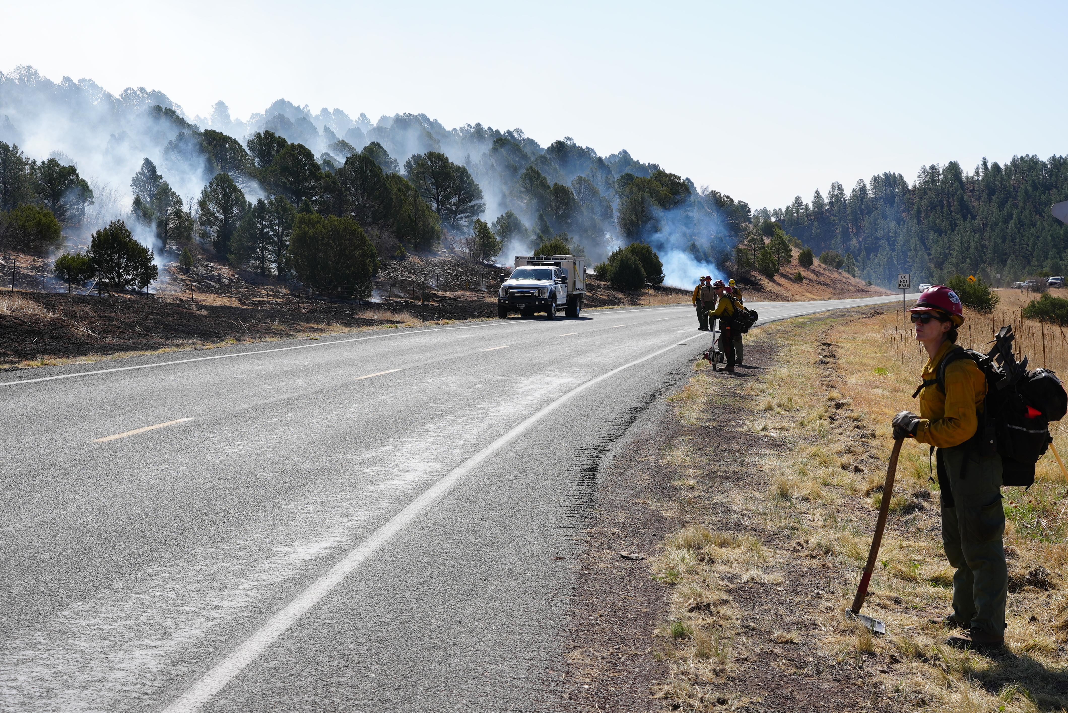 Firefighters are burning fuels along Highway 283 west of Las Vegas, NM to create a fire line to protect the community.