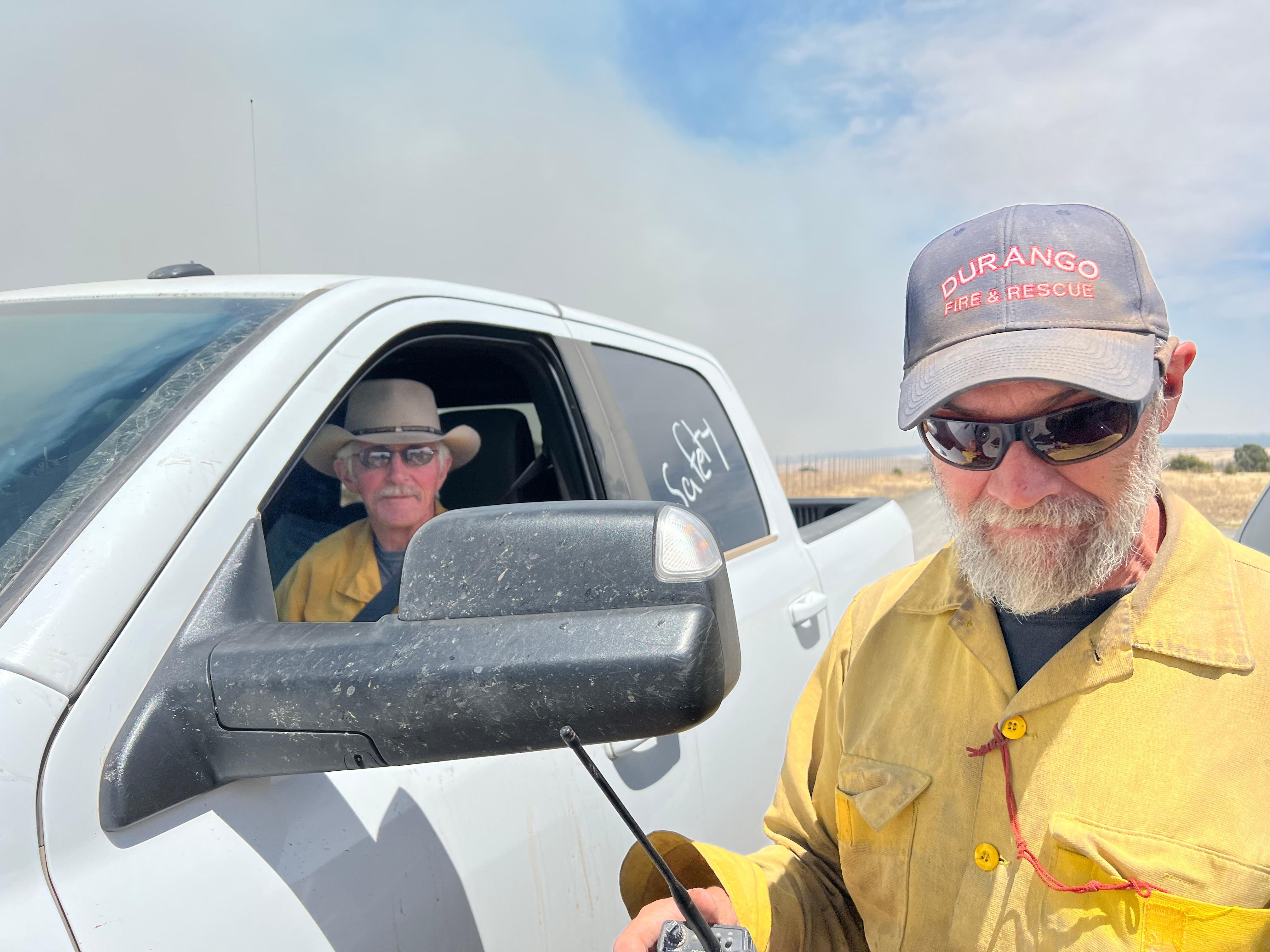 Experienced firefighters serve as safety officers, day and night, across different areas of the fire. In this instance, they had just informed the photographer that the fire was moving closer and it was time to move farther away.