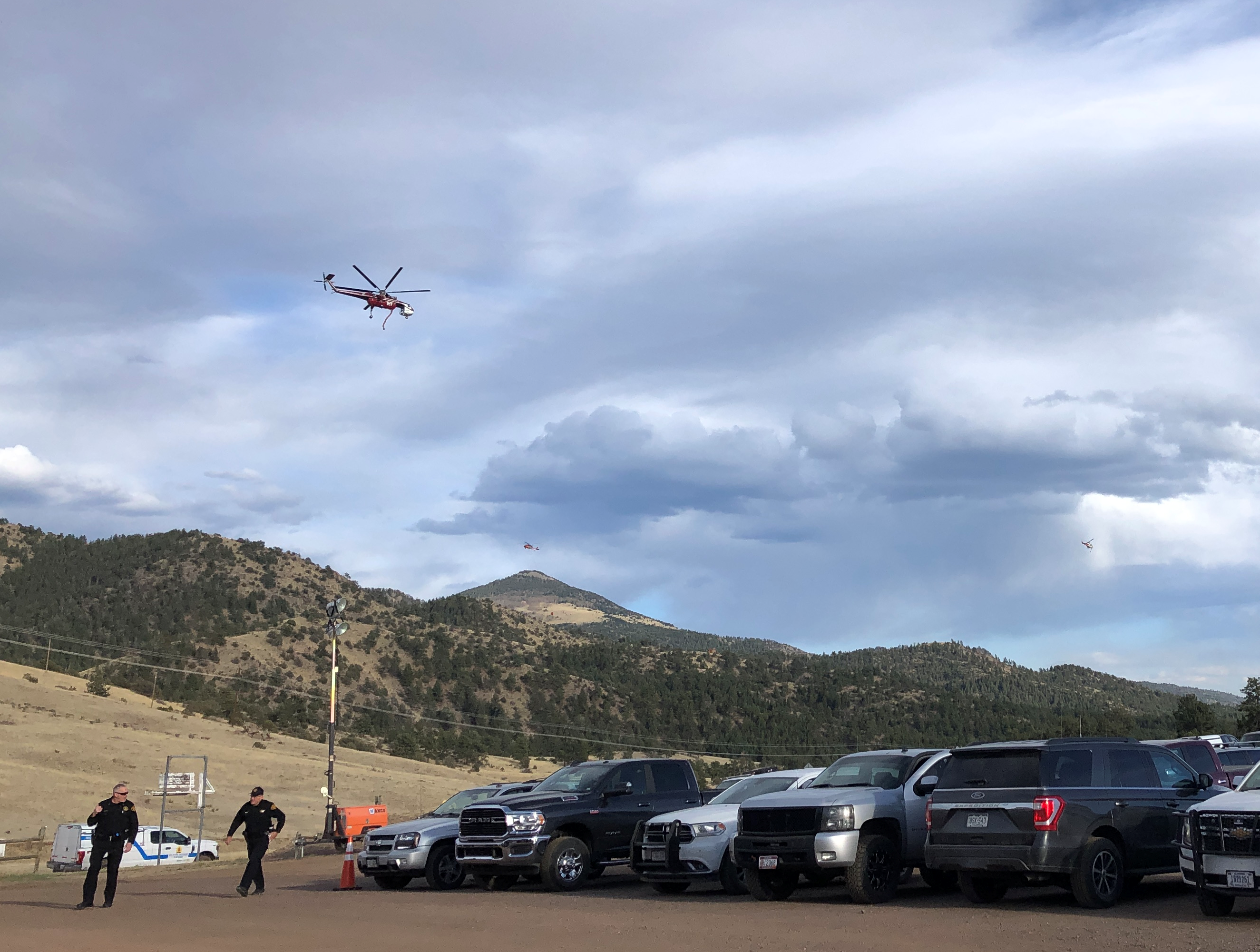 Three helicopters fly over the Incident Command Post on May 14.