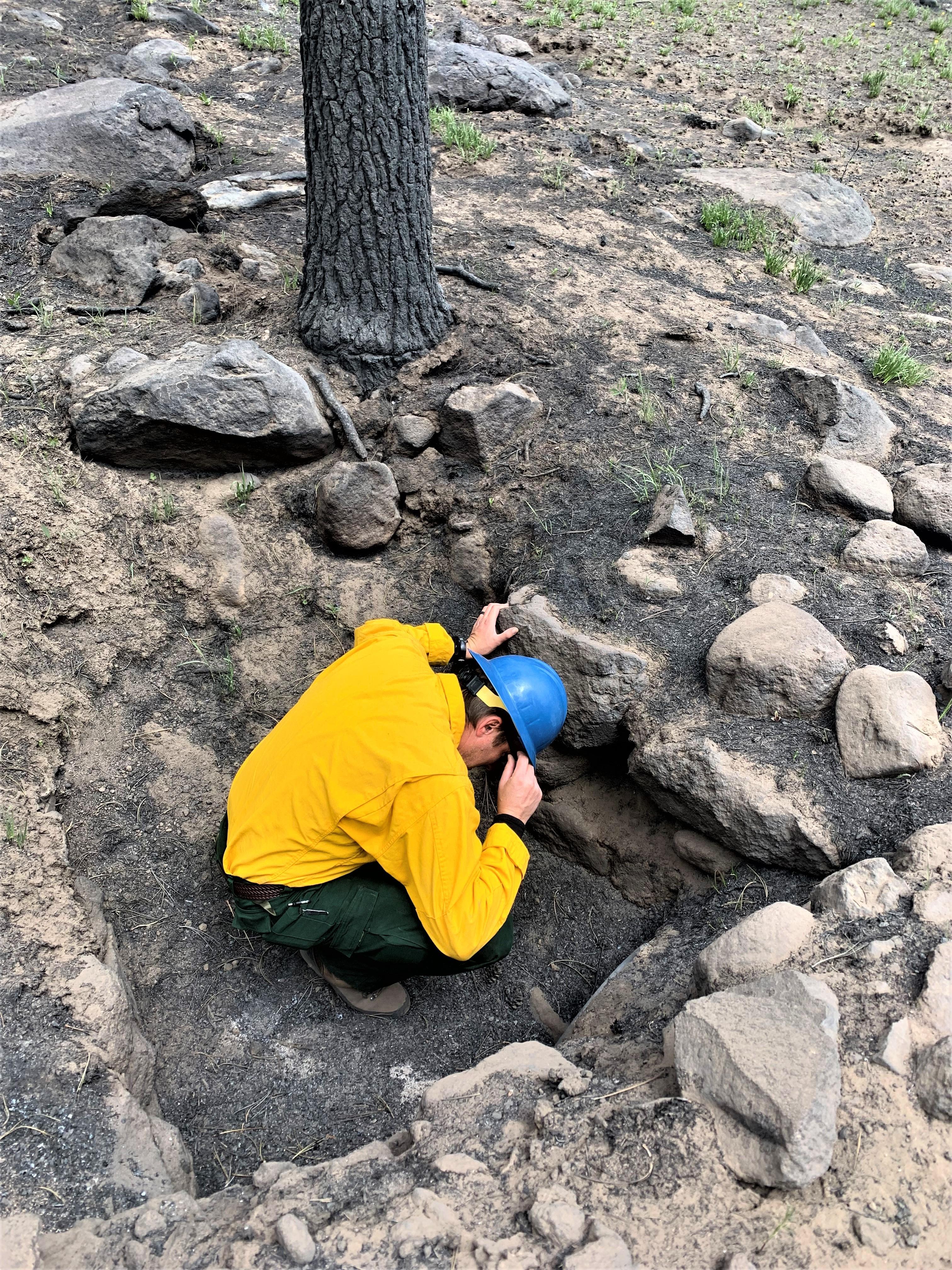 Image showing BAER Hydrologist Kyle Paffett checking a culvert on Forest Service Road FSR270 in the Cerro Pelado Burned Area