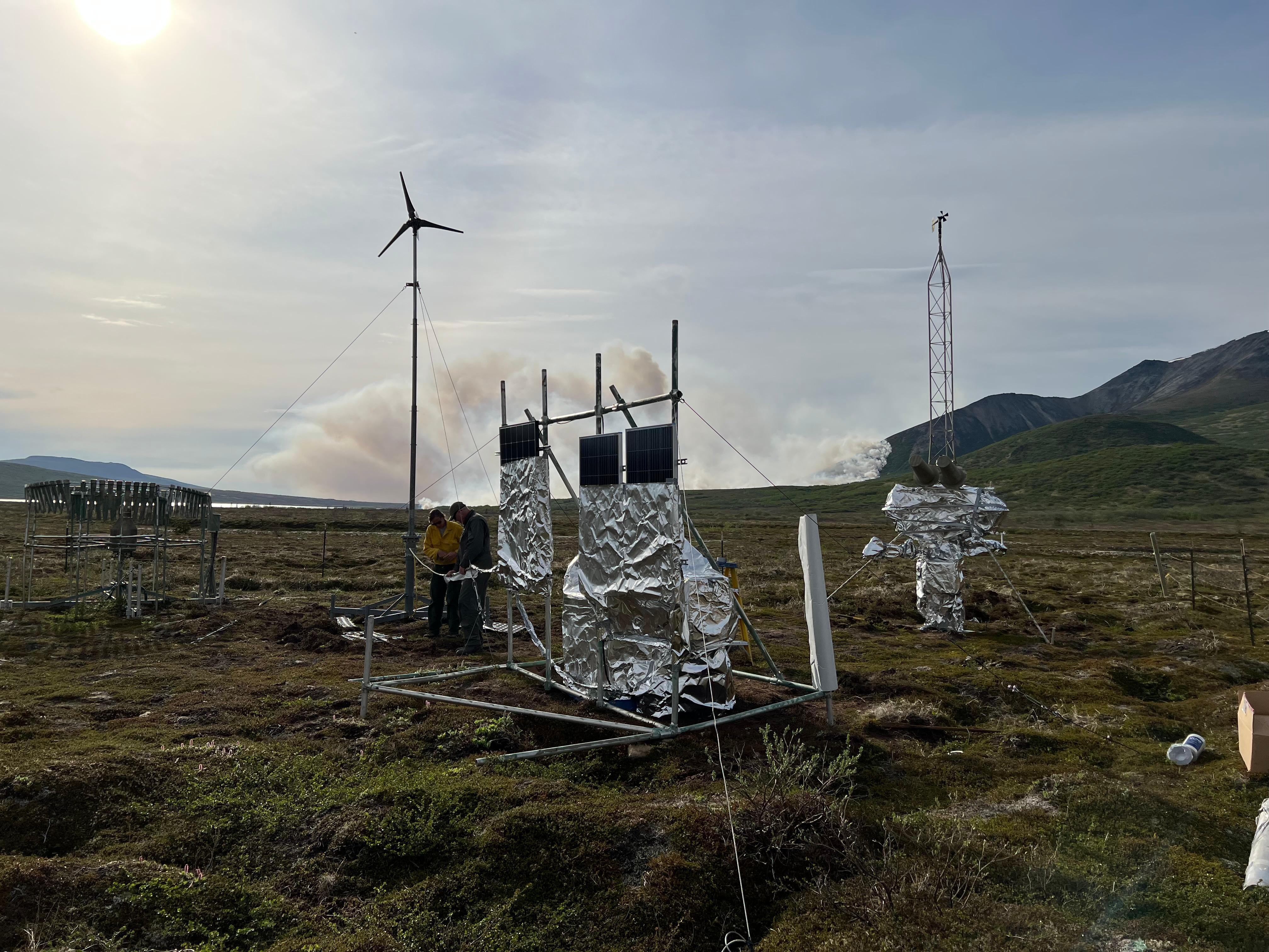 A Remote Automated Weather System (RAWS) in tundra wrapped in protective structure wrap