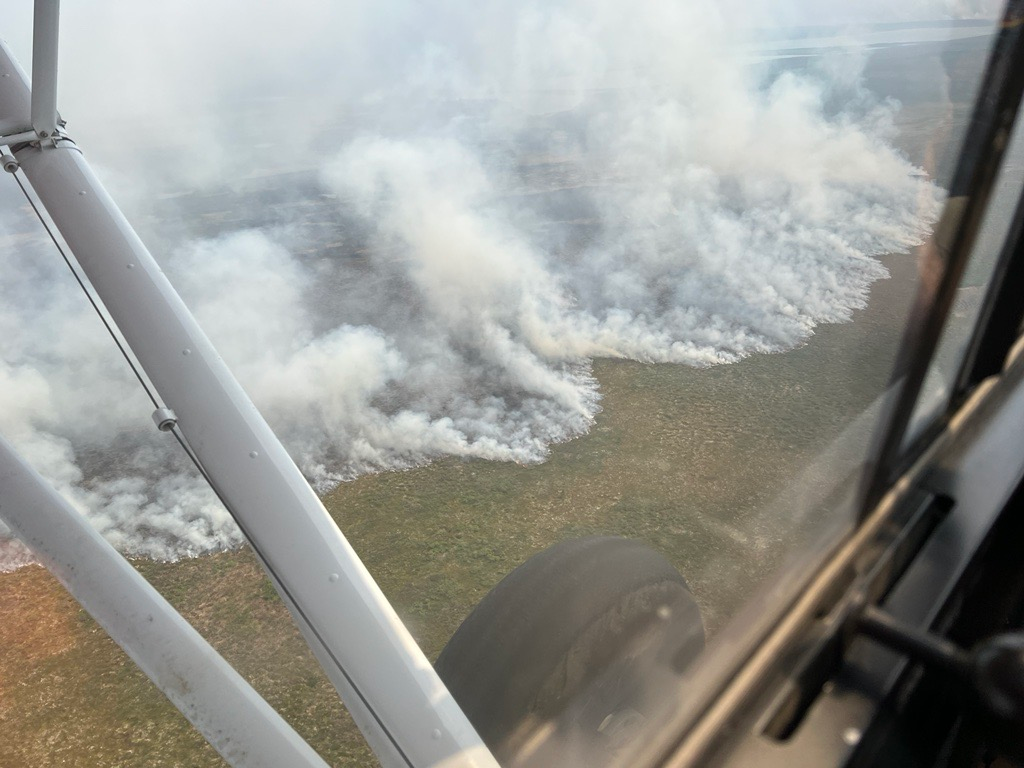 Aerial view of the Northwest flank of the Contact Creek Fire (#151). Active fire perimeter is expected to be slowed down by surrounding waterways in the next several days.