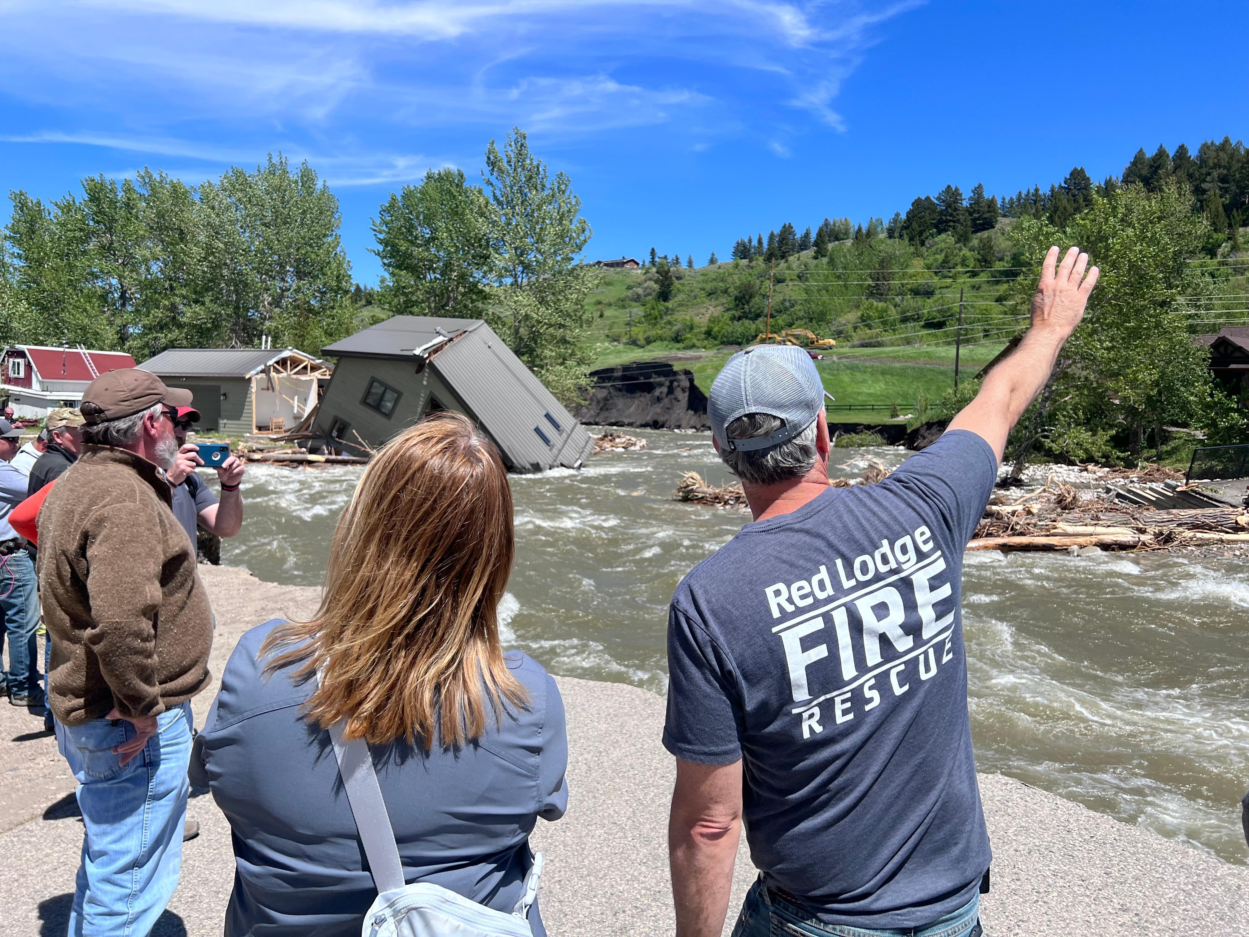 Red Lodge Fire and Rescue Chief, and FEMA Administrator, touring the flood damage in Red Lodge. ge