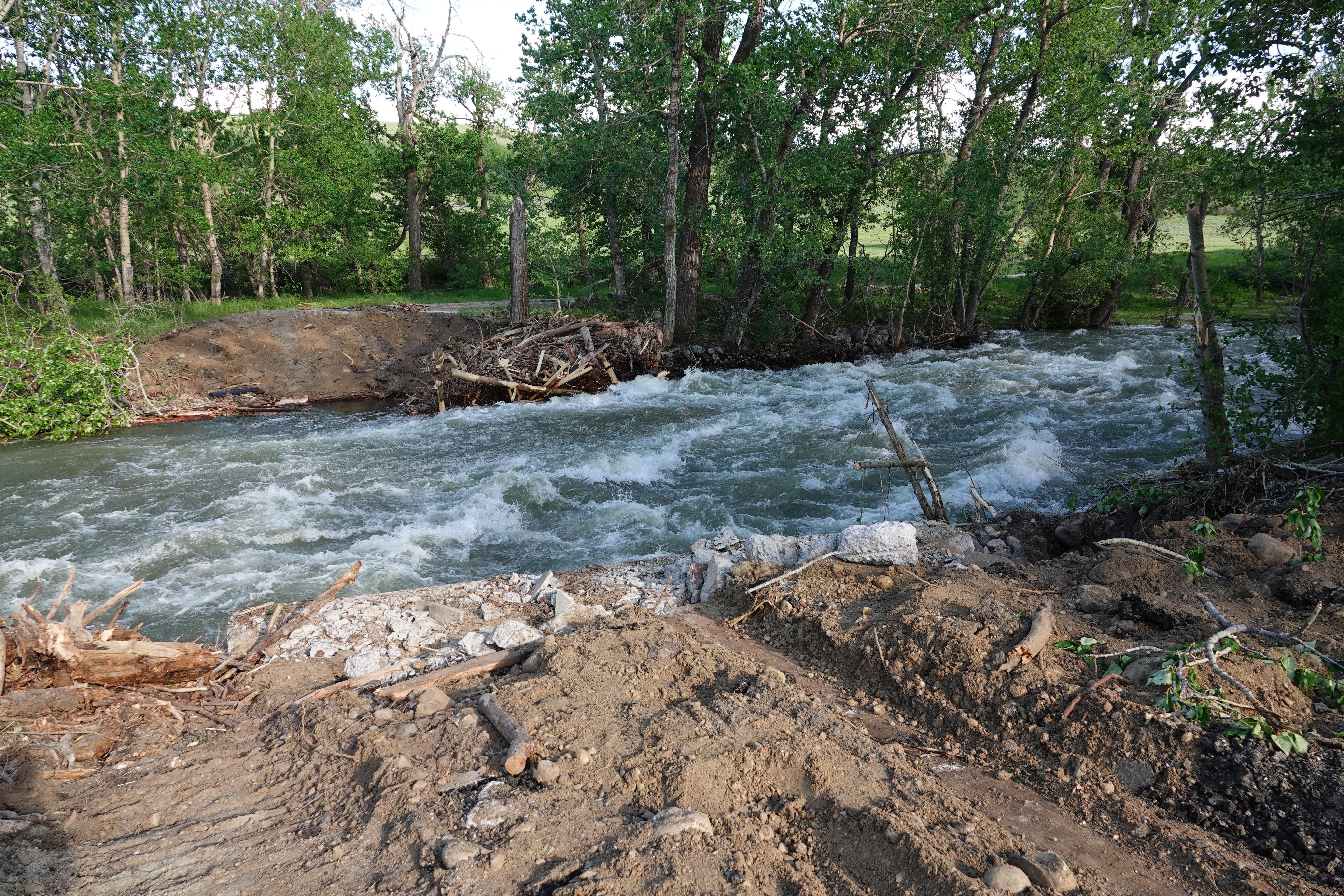 Fast flowing Rock Creek with bridge absent