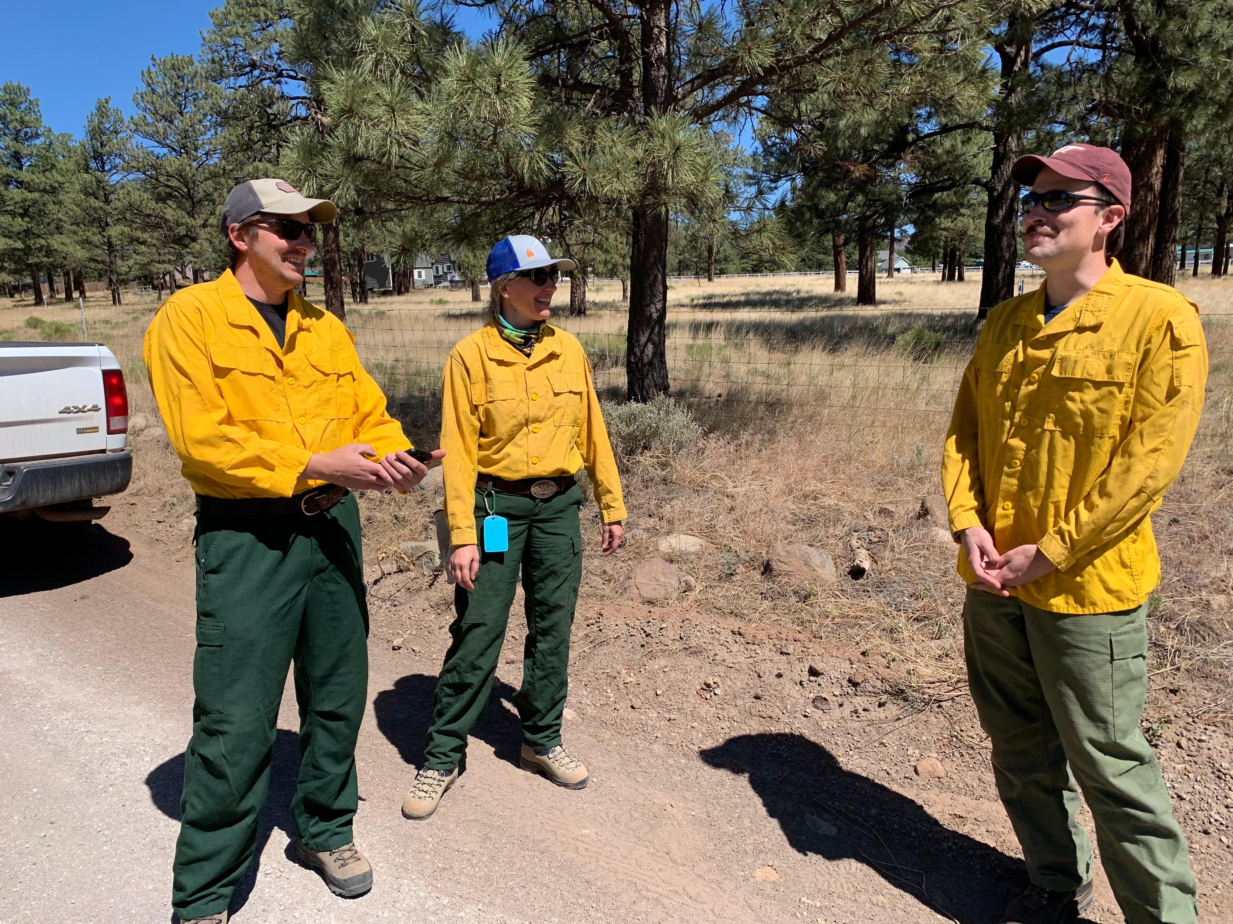 BAER Team members discuss mobile maps prior to beginning soil burn severity validation on June 22, 2022.  BAER team members are from left to right hydrologists Kyle Paffett and Kelly Mott Lacroix and soil scientist Rob Ballard. photo: Mark Christiano USFS