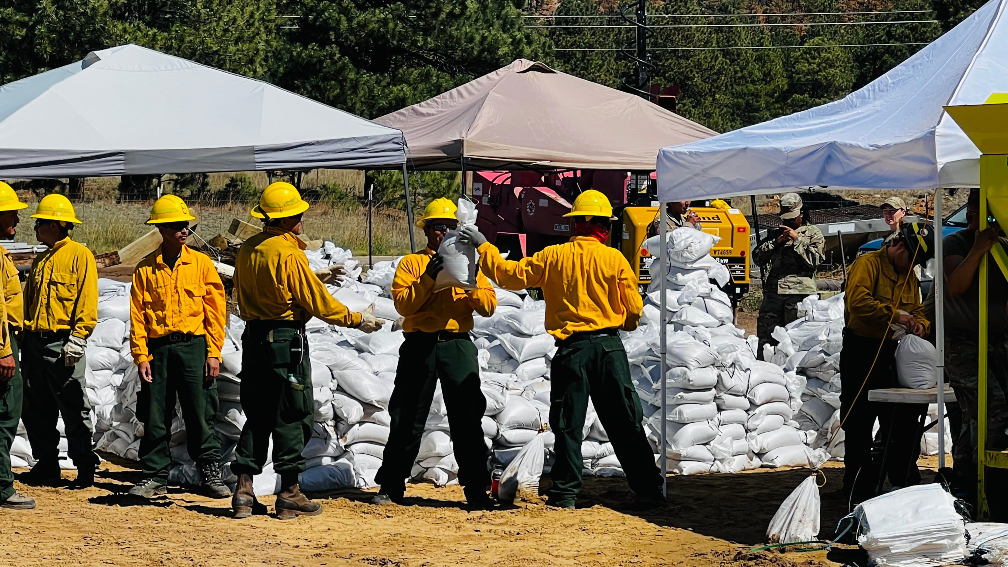 Firefighters filling sandbags for public use 6-28-22