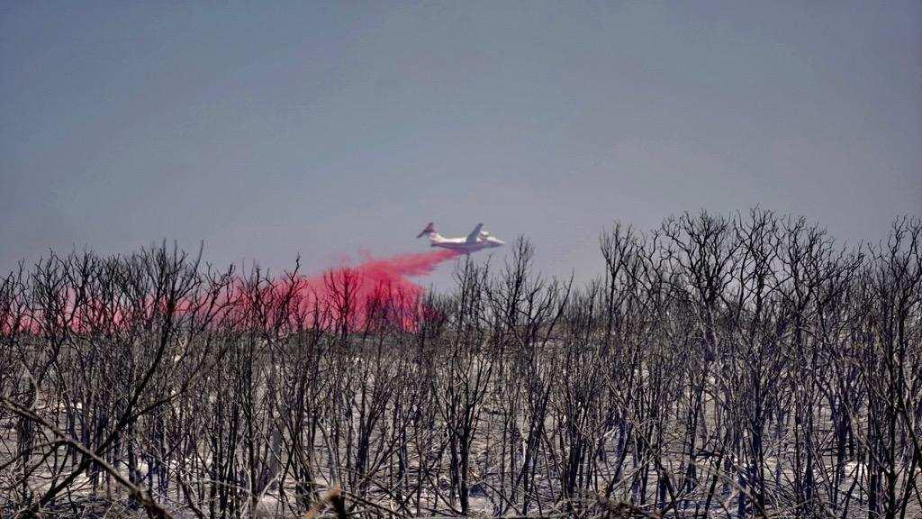 A retardant drop on the Chalk Mountain Fire. Photo from Nathan Carroll, District Coordinator for the Texas Division of Emergency Management.