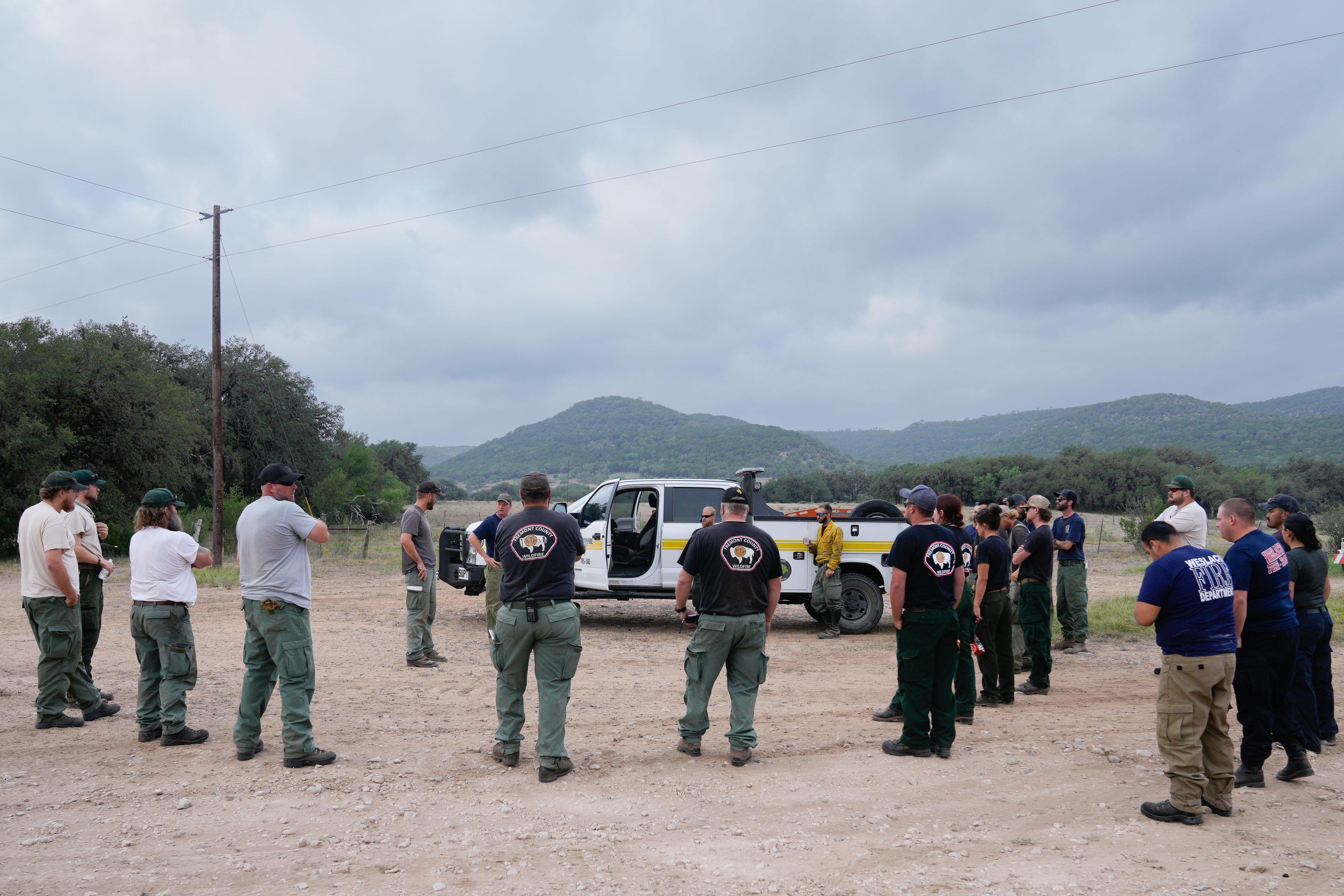 firefighters listening to morning operational briefing