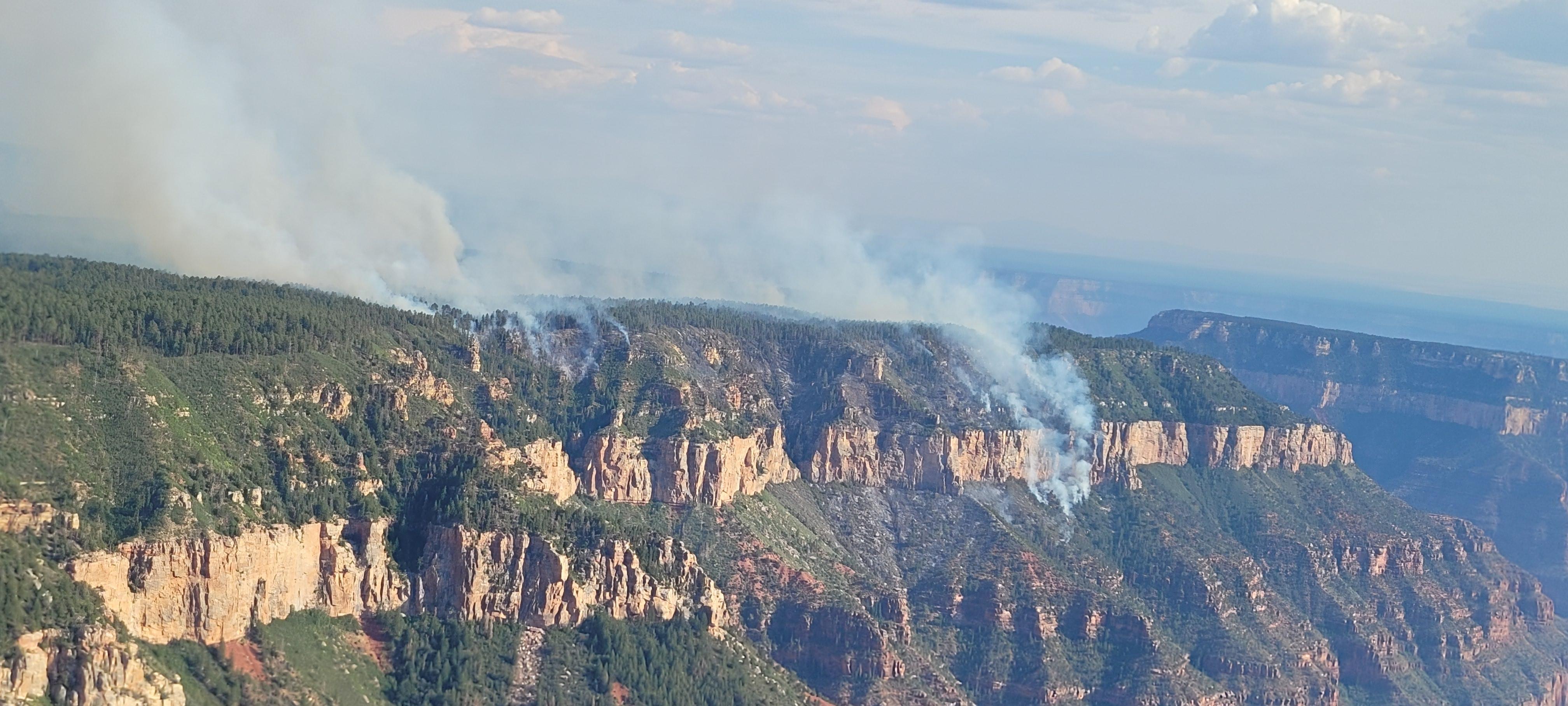 Aerial view of the Dragon Fire; fire is seeing traveling below the rim of the Canyon into the Coconino Layer on 7-21-2022