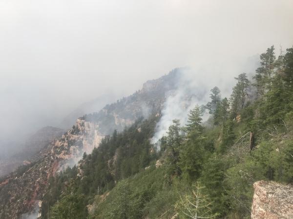 A hazy canyon is seen filled with smoke from the Dragon Fire on 7-22-22