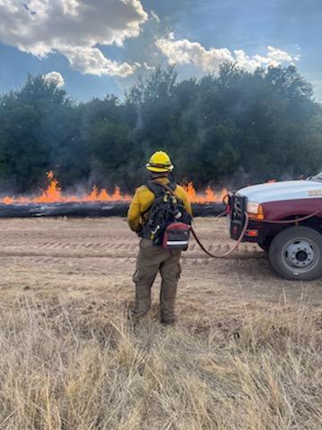 An engine crew member works along the northern edge of the Long Creek Fire on Wednesday afternoon PC: Logan Sandman