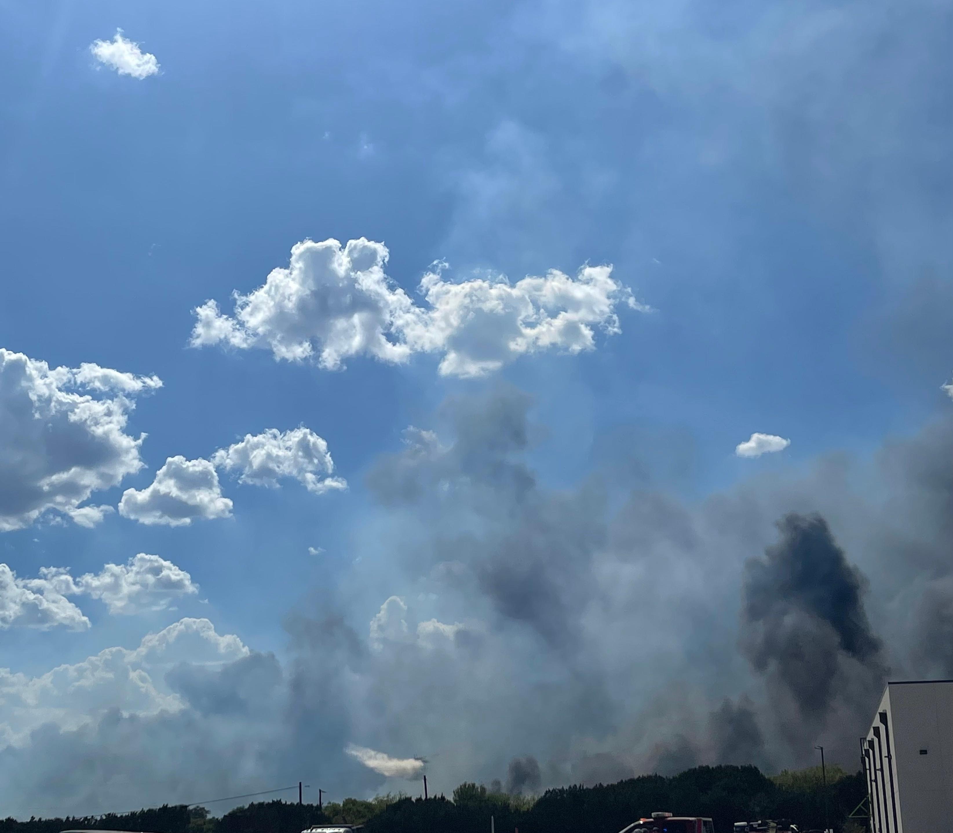 Fire Boss plane dropping water on the fires edge