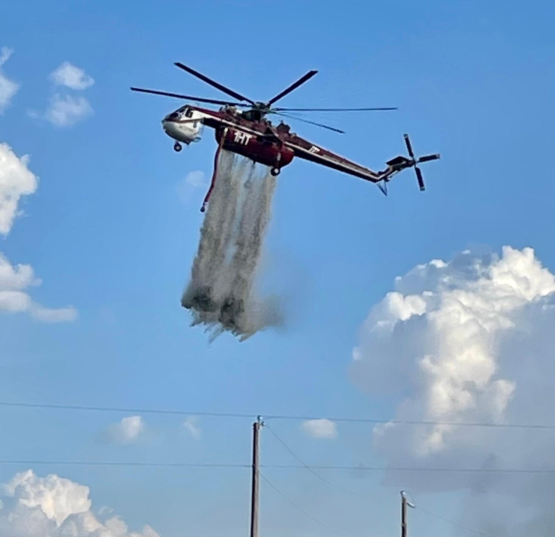 Helicopter dropping water 