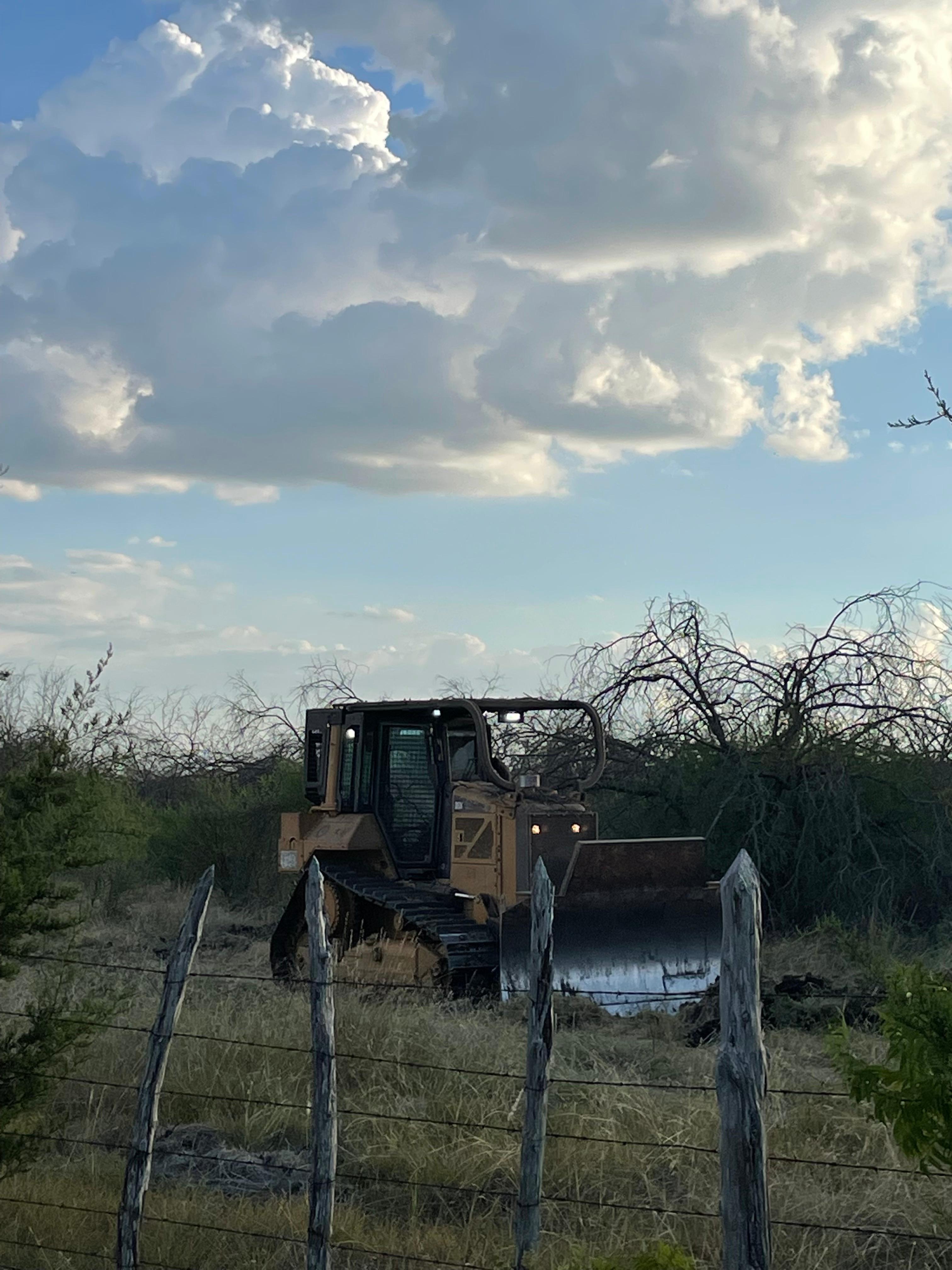 Bulldozer putting in contingency lines