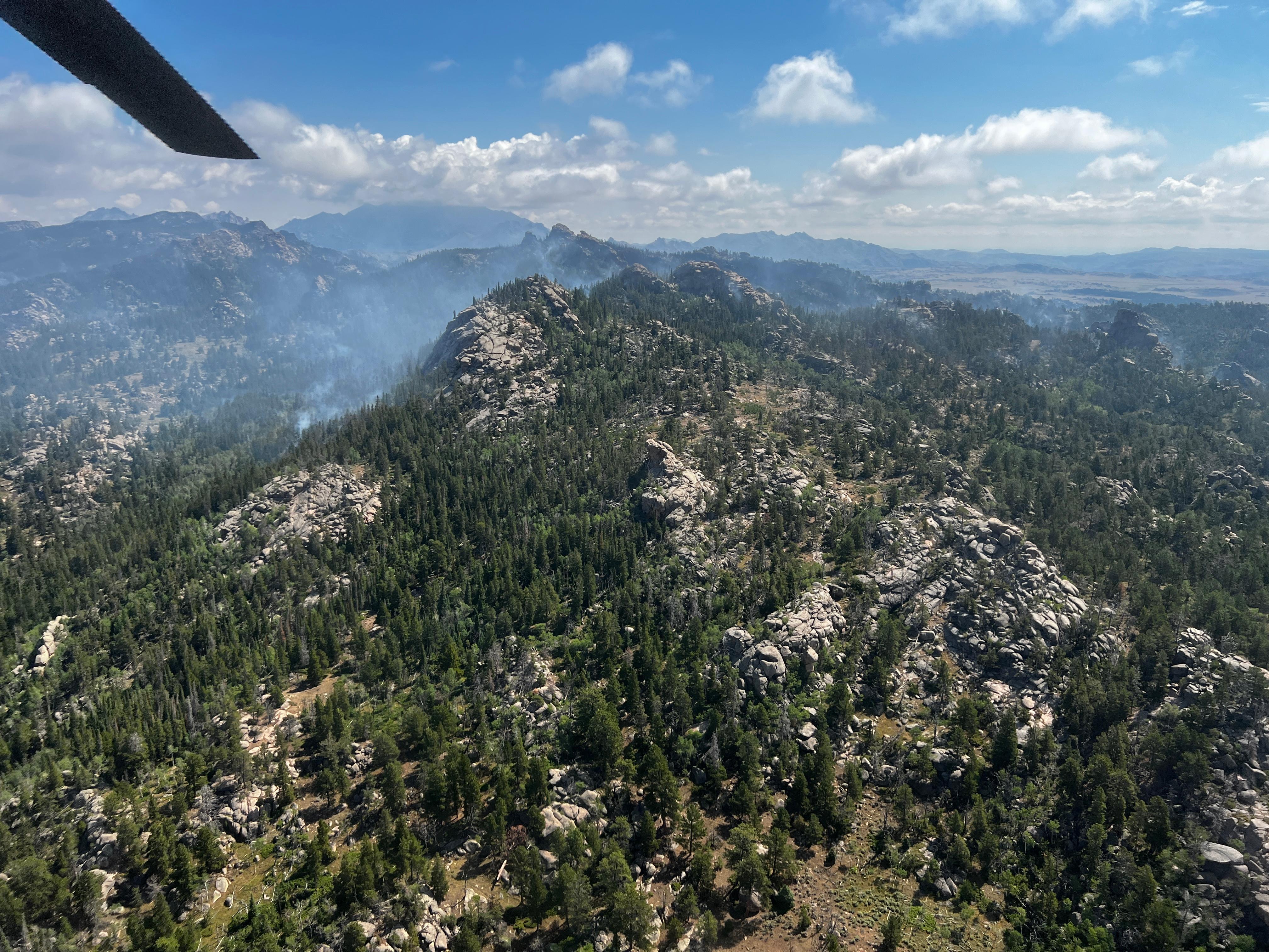 Aerial with light smoke over Sugarloaf Fire