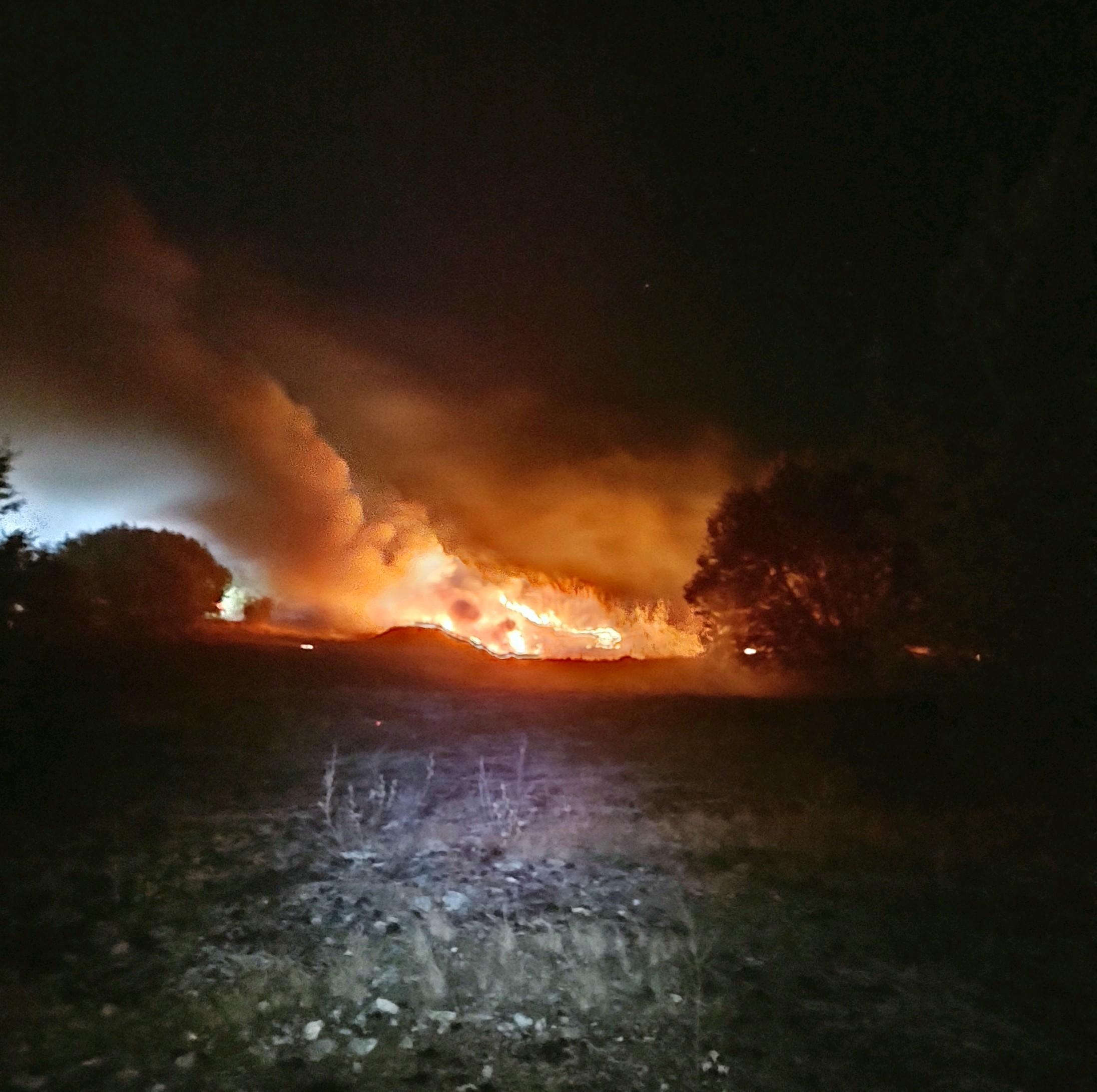Nighttime flareup on northern perimeter of fire. Photo Credit: Chris Owens