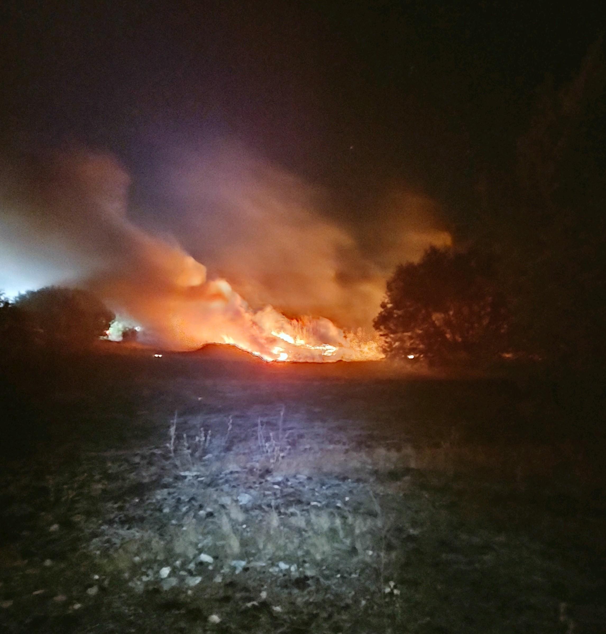Nighttime flareup on northern perimeter of fire. Photo Credit: Chris Owens