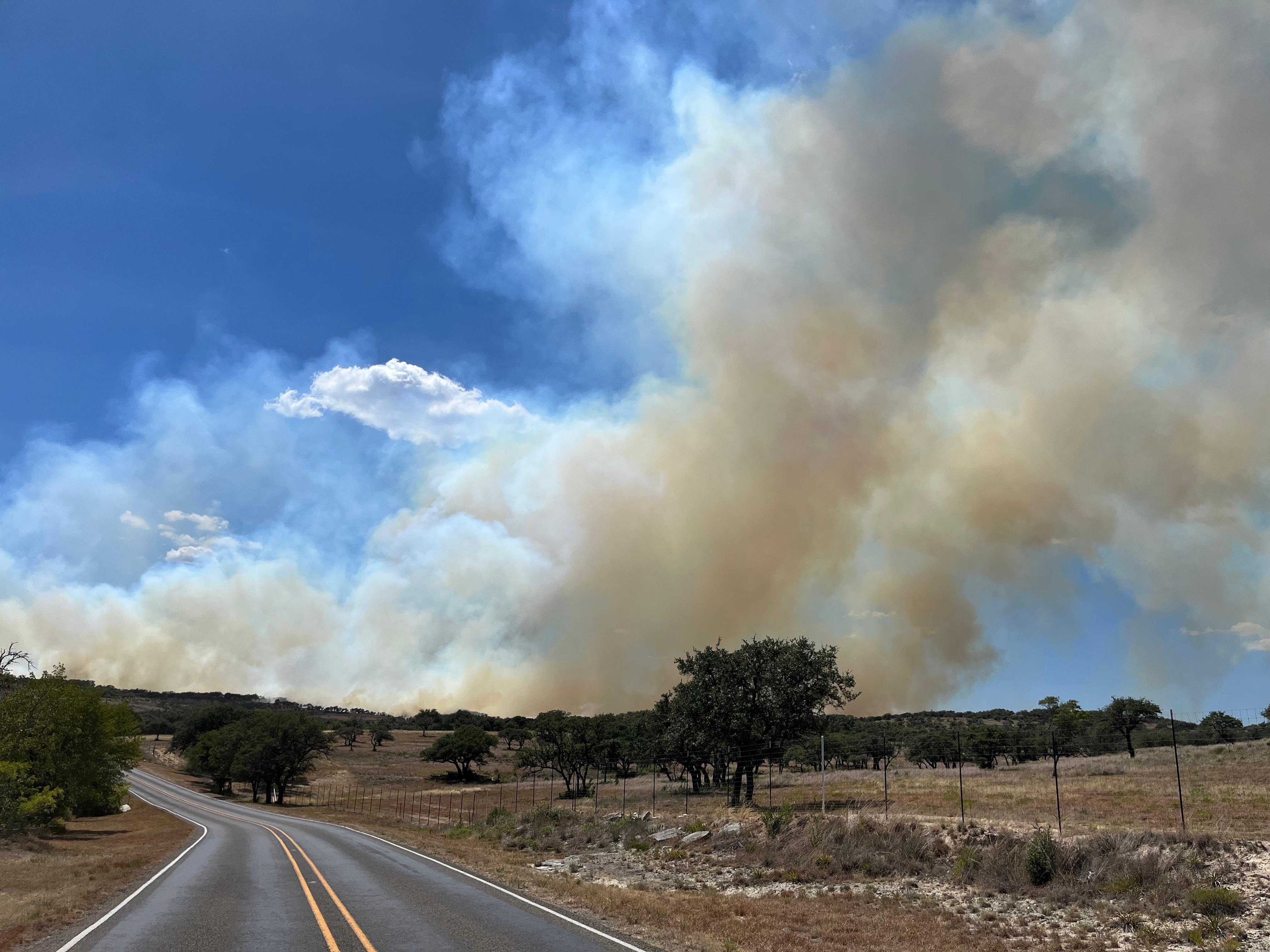 Smoke shows from Highway 290 on the Smoke Rider Fire in Hays County, August 2, 2022