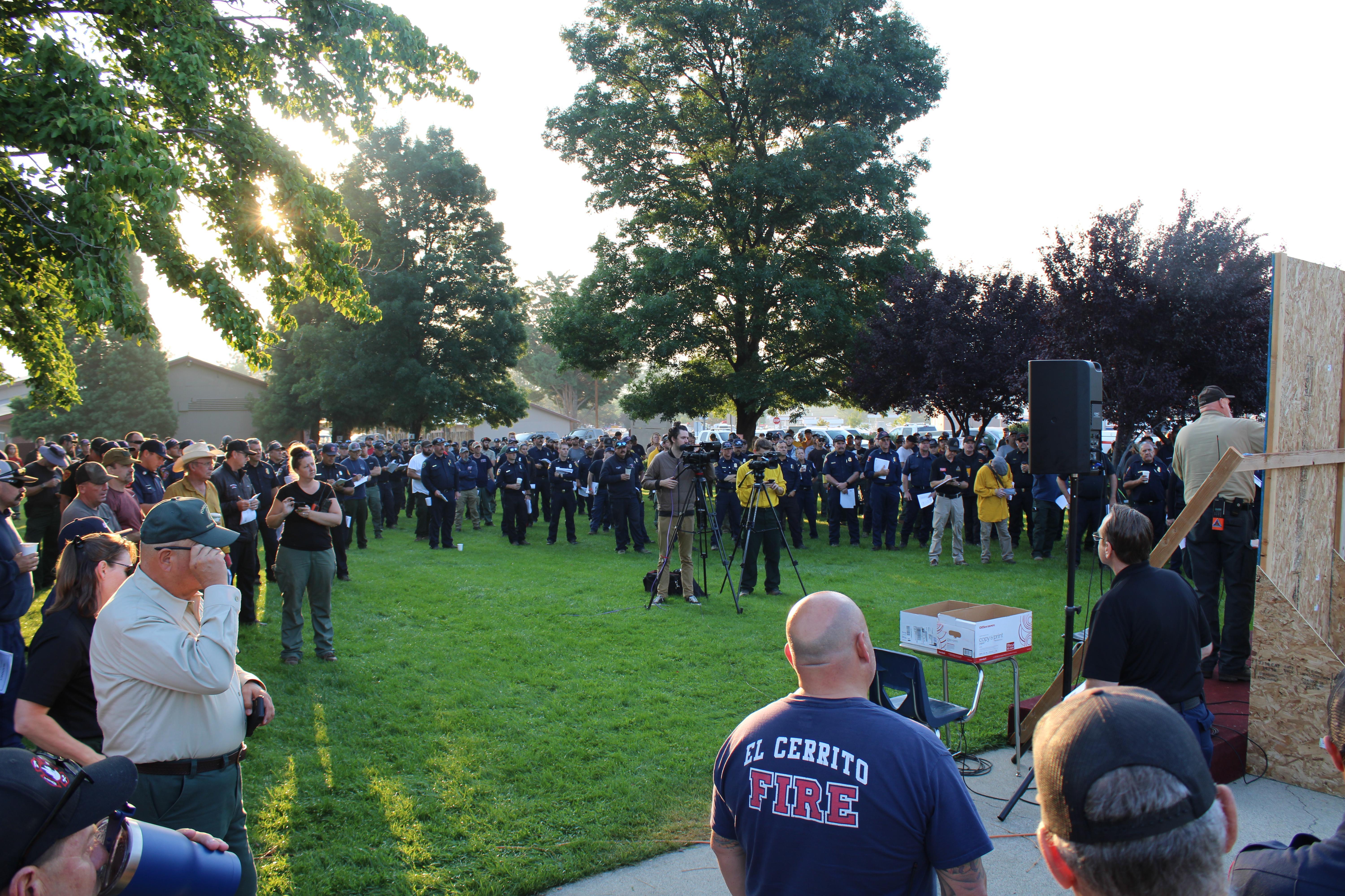 Firefighters attend the morning briefing for the McKinney Fire on August 3, 2022
