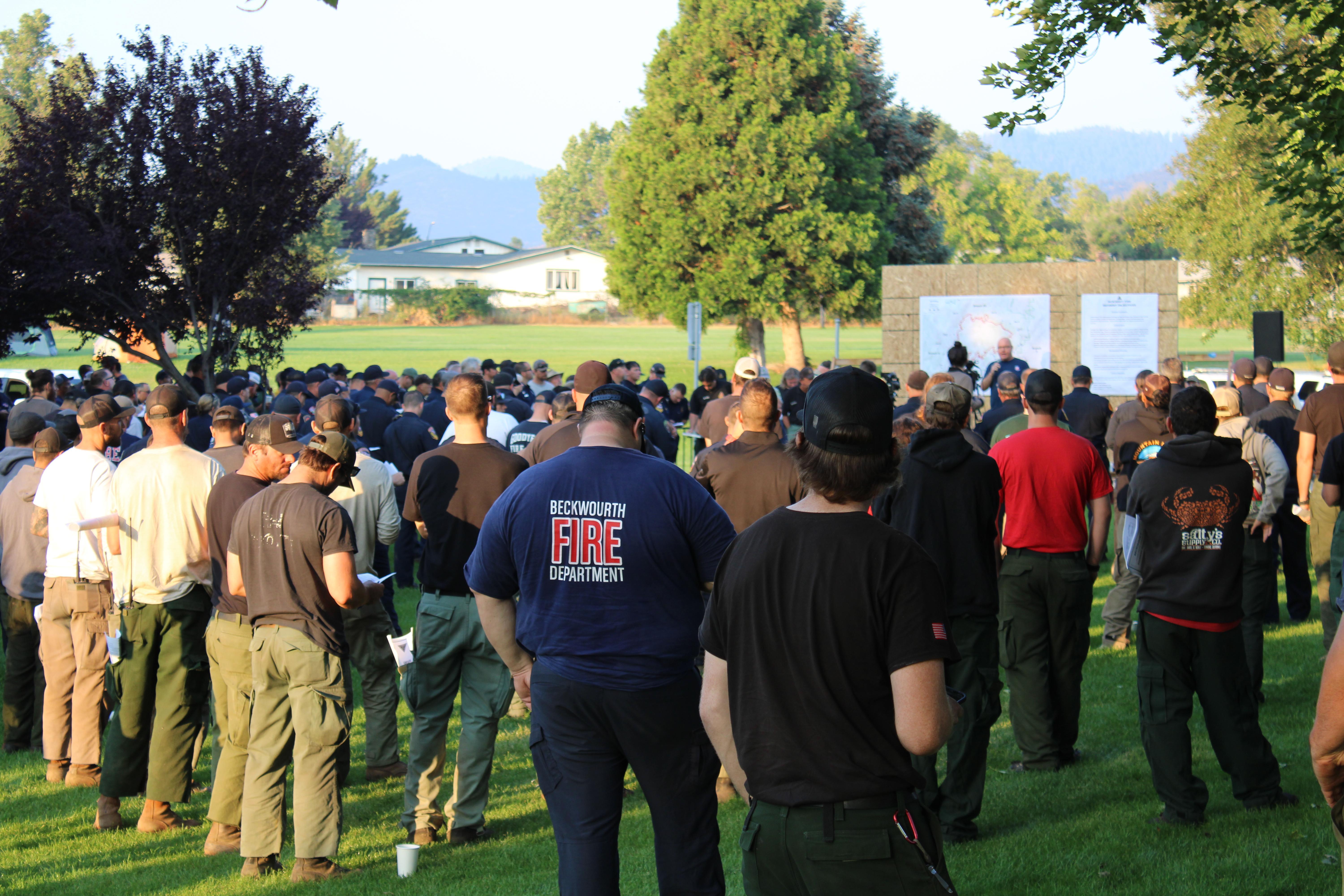 Firefighters attend the morning briefing for the McKinney Fire on August 3, 2022