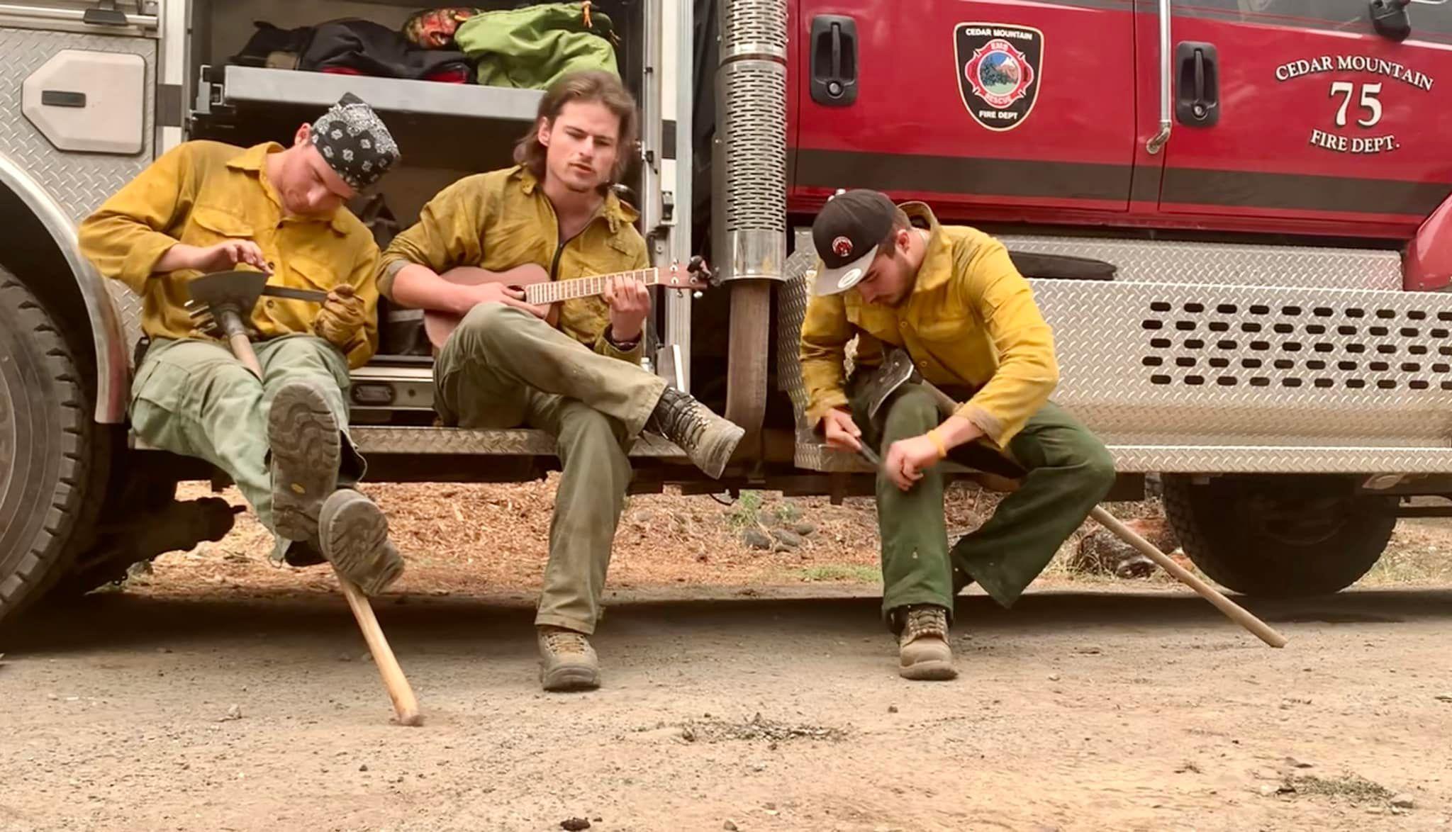 Crew sharpening hand tools on the fireline