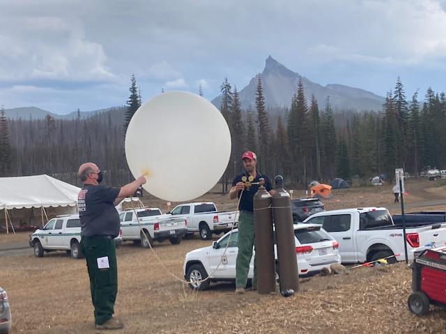 Meteorologists releasing weather balloon