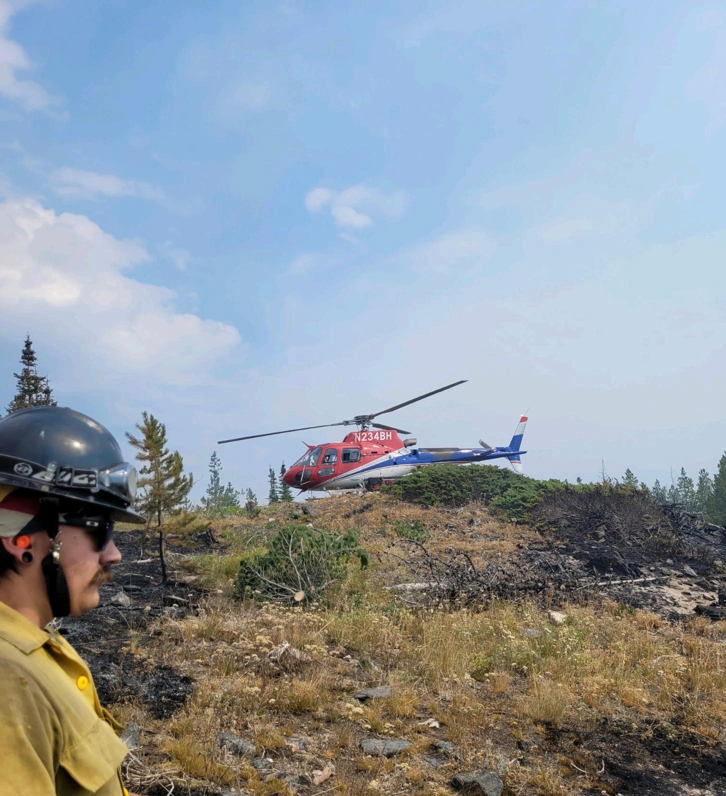 Helicopter drops off firefighters on Eneas. Photo credit  R. Wagner
