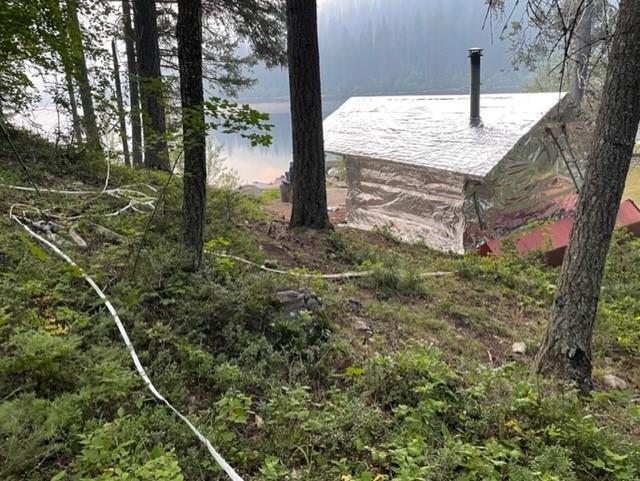 Quartz Lake Patrol Cabin with structure wrap and hose lay Aug 18