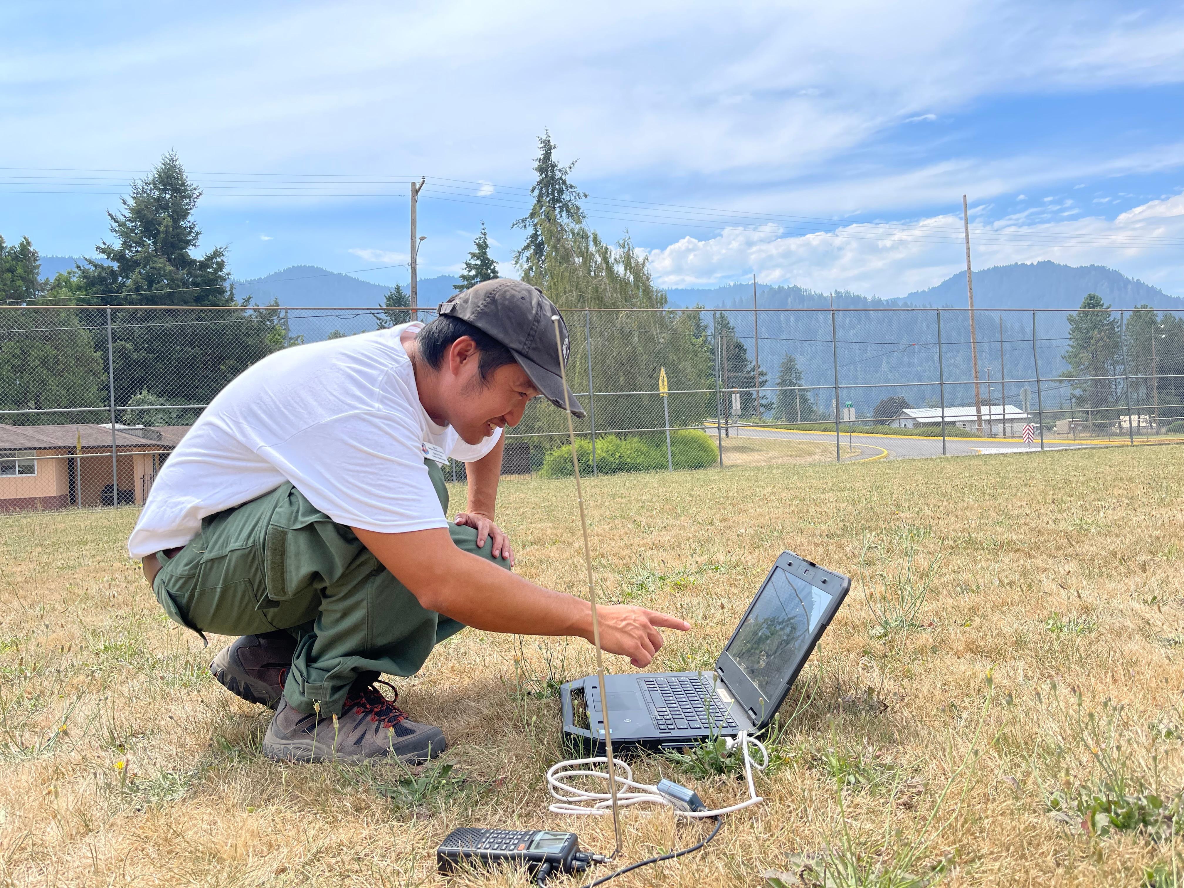 Incident Meteorologists like Genki Kino launch weather balloons on the Cedar Creek Fire to collect site-specific data that may be difficult to get. The instrument is tracked by a radio receiver and transmits data that includes temperature.