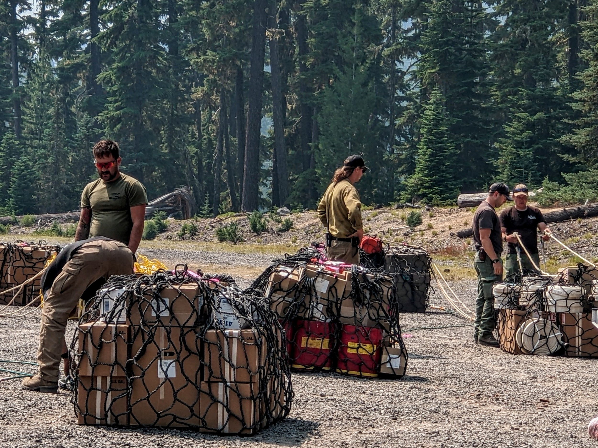 Firefighters Preparing Supplies to Sling into spike camp for hand crews 