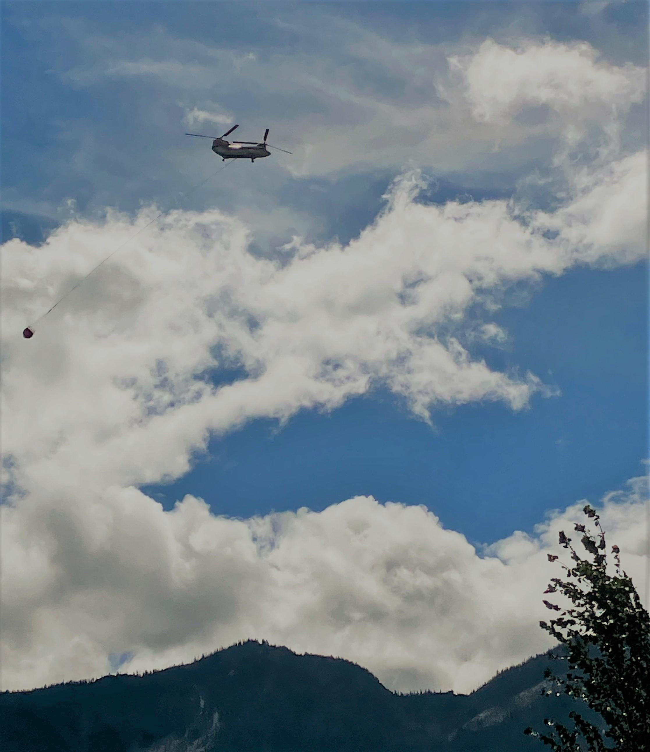 Helicopter carrying water for White River Fire