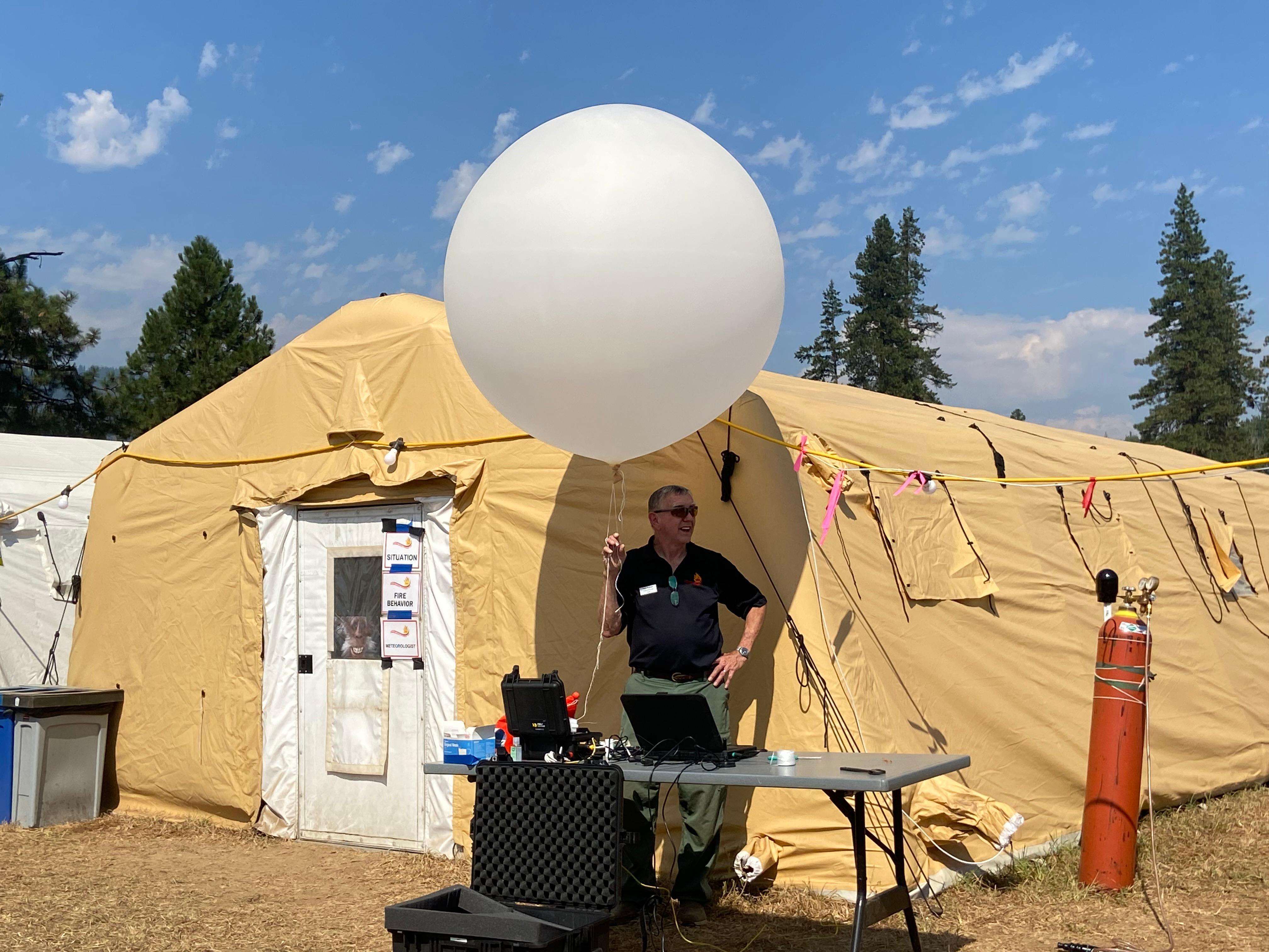 Launching a weather balloon from the White River Fire Camp.
