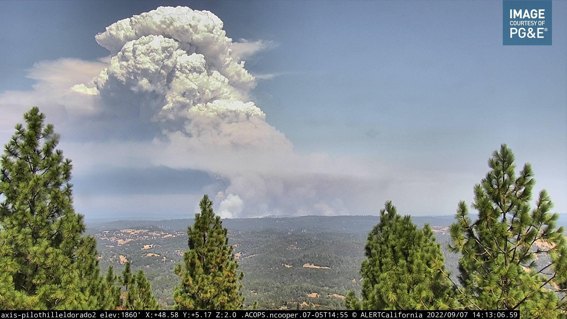 A large plume of smoke seen rising from the Mosquito Fire as seen from Pilot Hill Cam part of Alertwildfire.org