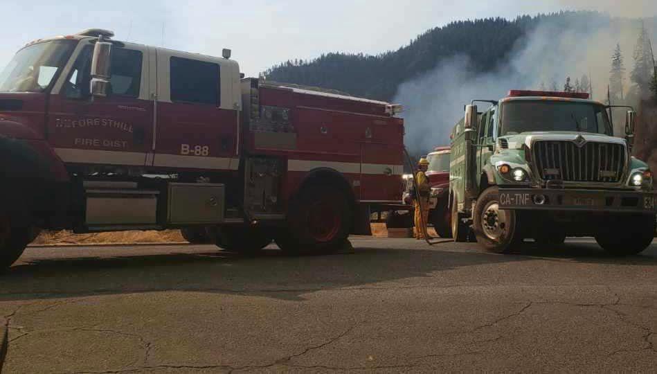 Tahoe NF Engine and firefighters engaged in fire suppression