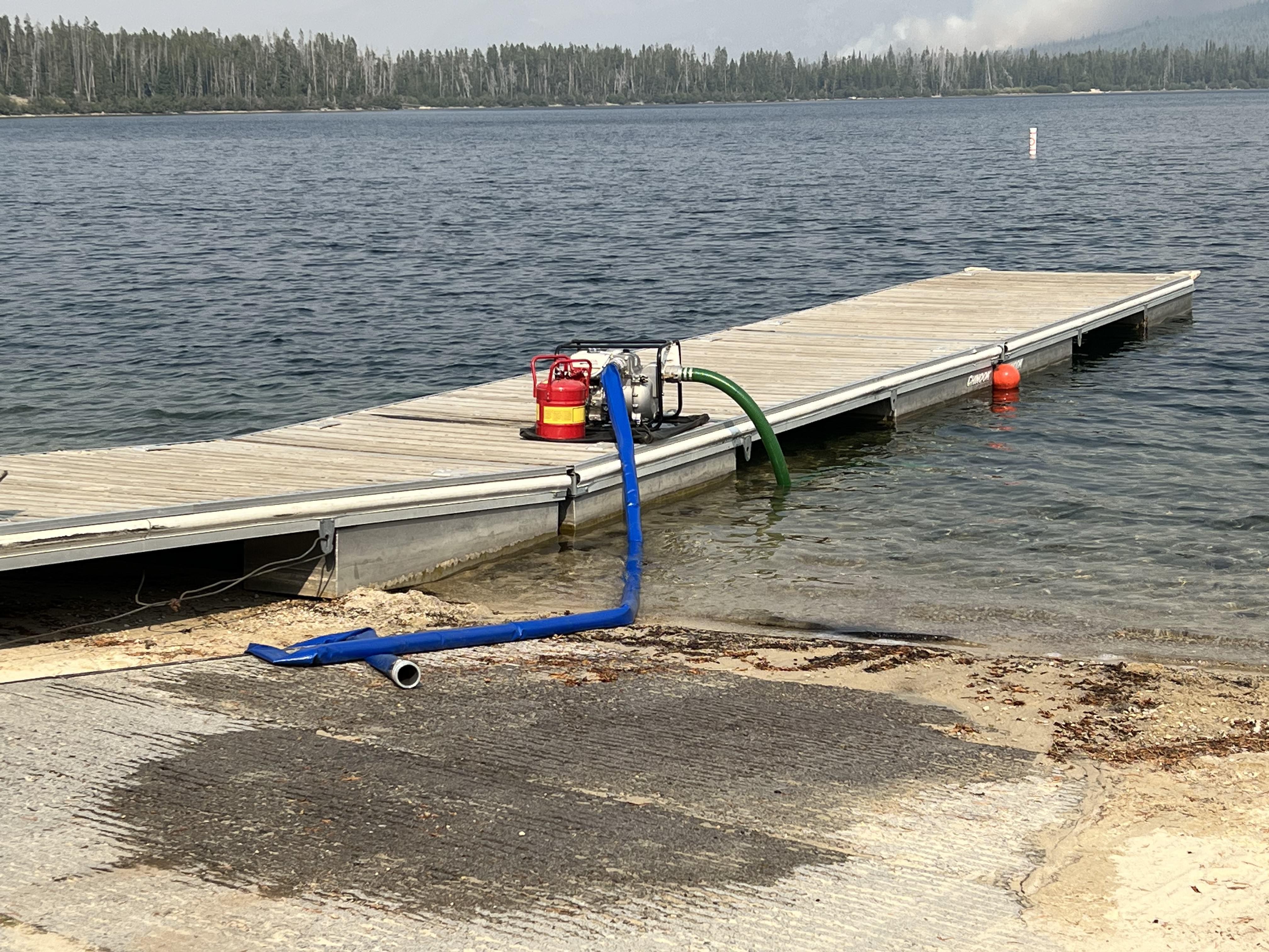 Water pump and hose sits at Alturas Lake